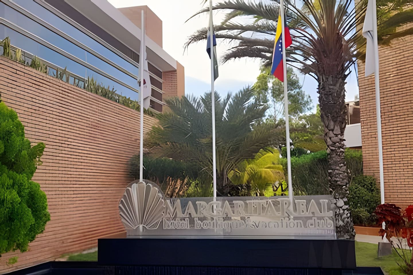 Modern elegance meets tropical beauty at the entrance of your next vacation destination.
