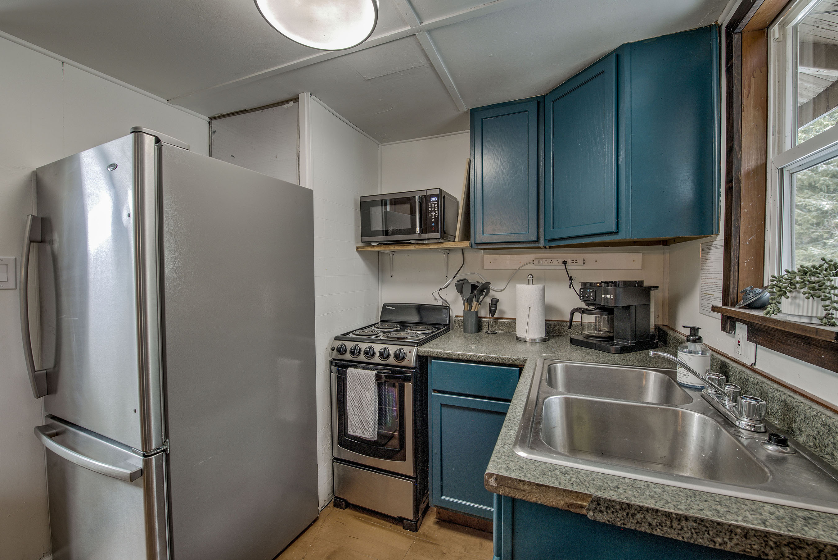 Whip up your favorites in your compact kitchen—modern appliances, ample counter space, and everything you need to make meals feel easy and yours. Complete with a Keurig coffee maker for both grounds and K-Cups. 