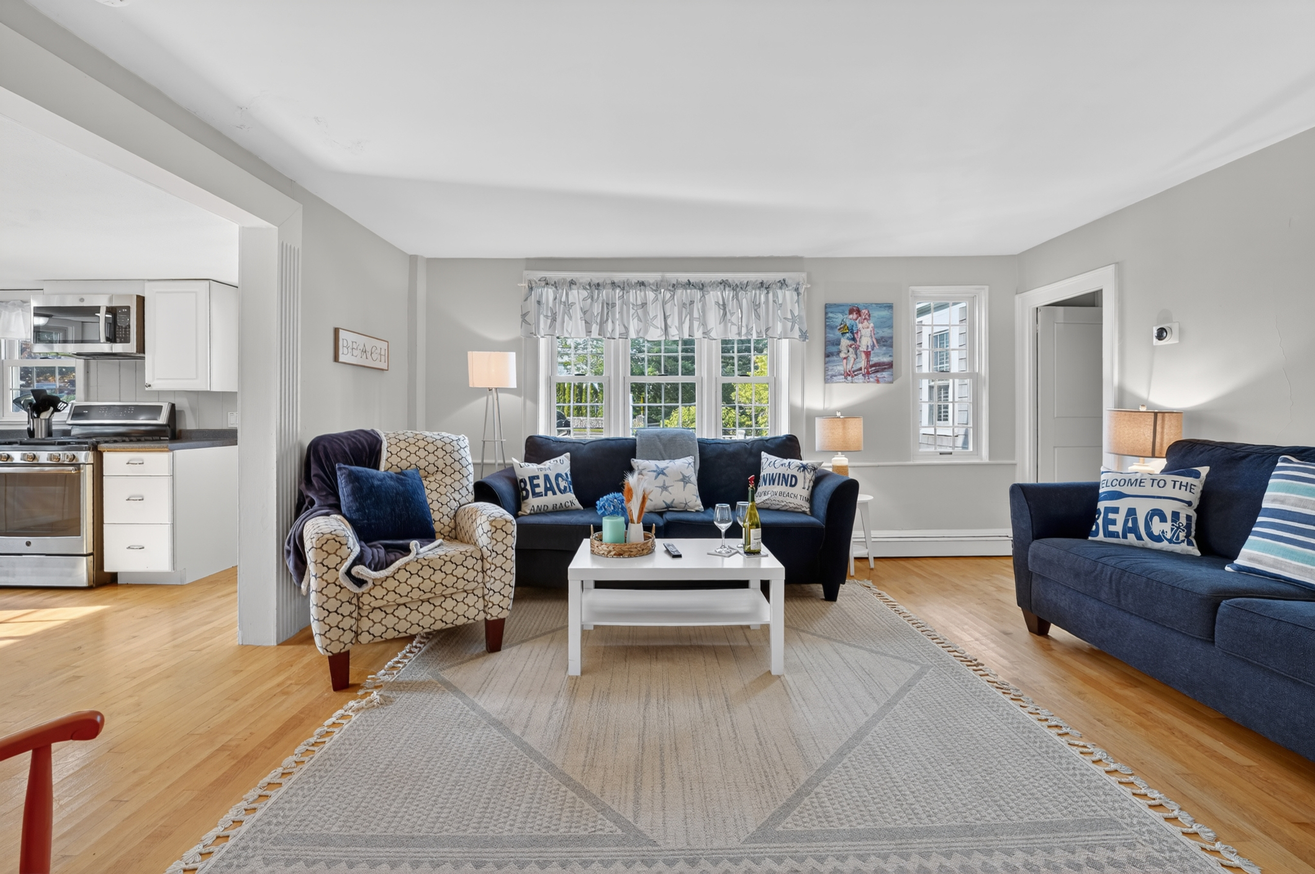 Bright, open living room with comfortable seating for everyone to relax.