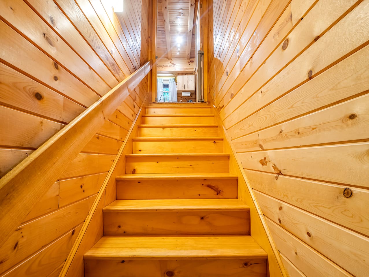 Stairwell coming off kitchen, leading to basement level
