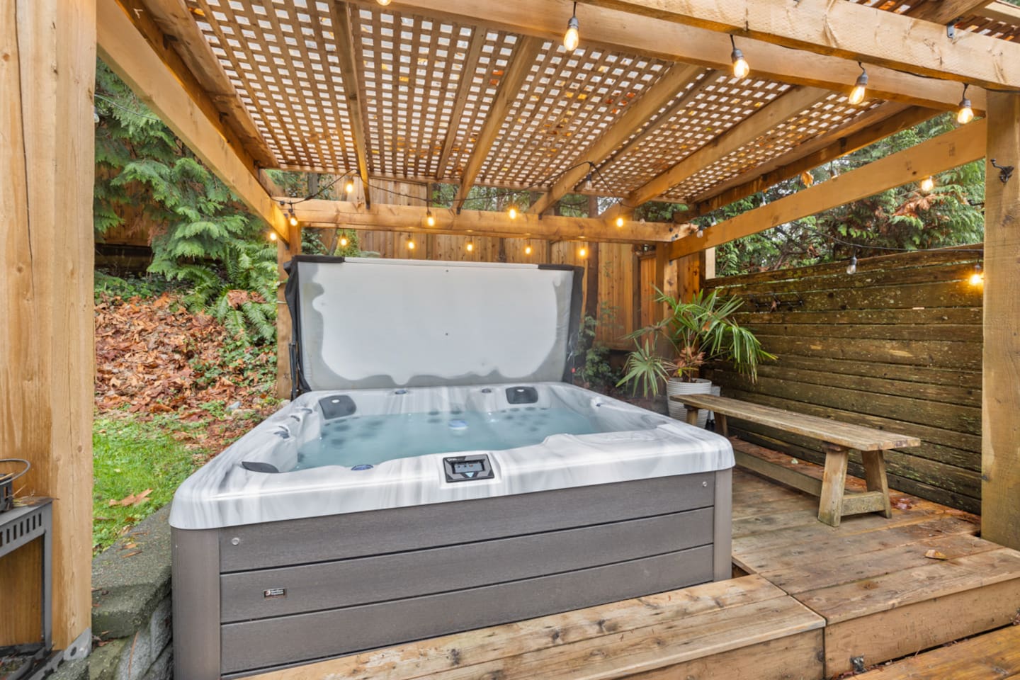 Outdoor hot tub with cover
