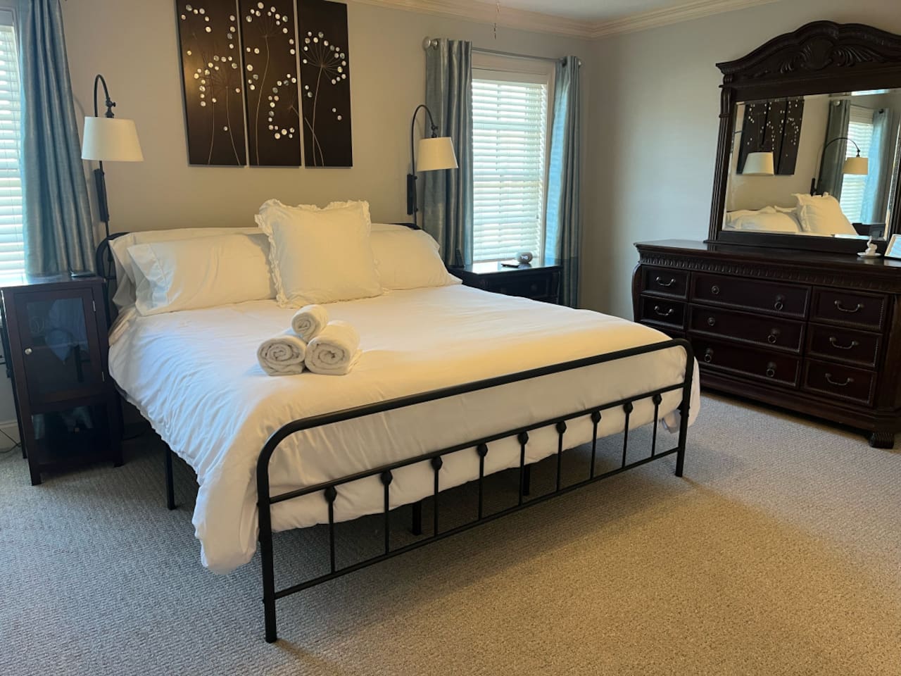 Simple and spacious bedroom with a clean, minimalist design, offering plenty of room to relax and unwind in comfort.