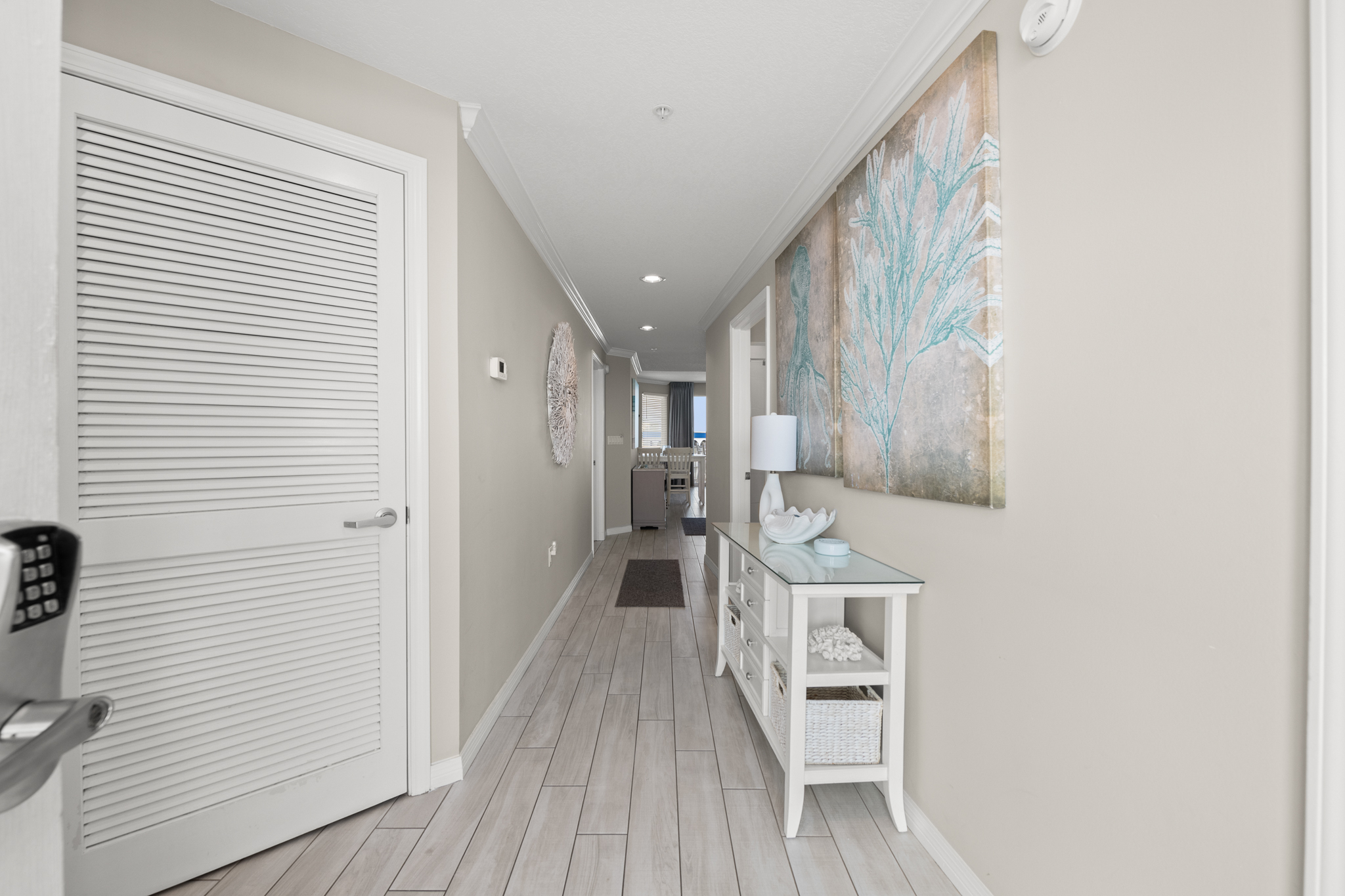 Clean hallway connecting the spaces with a bright, open feel.