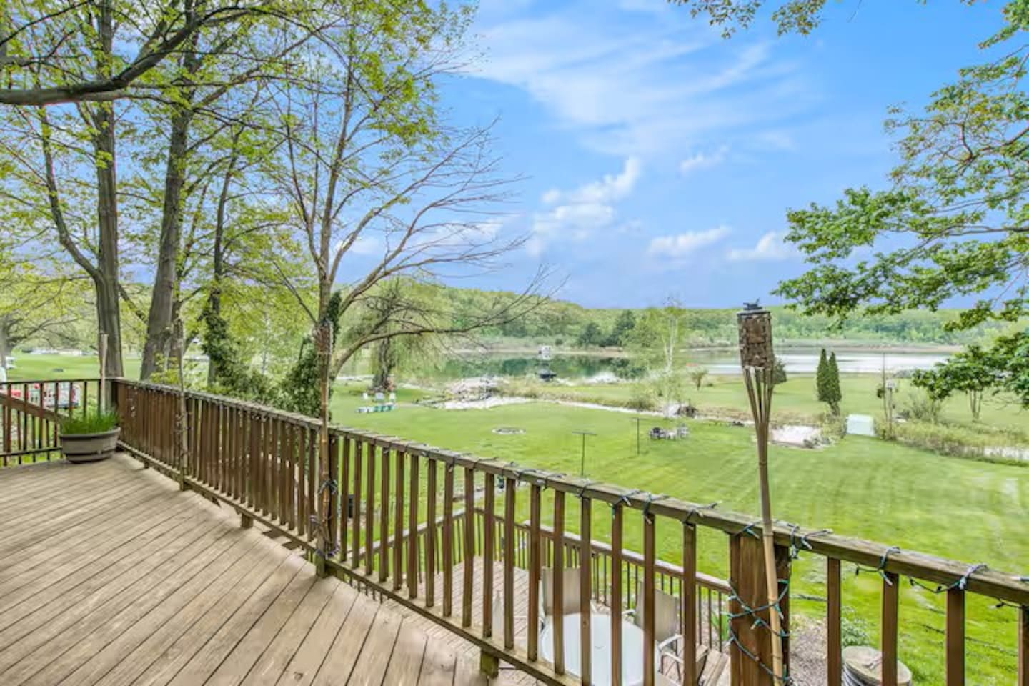 Very spacious yard that leads down to the lake with your own private dock. Also not shown here is a large seating area with a fire pit in center of yard.
