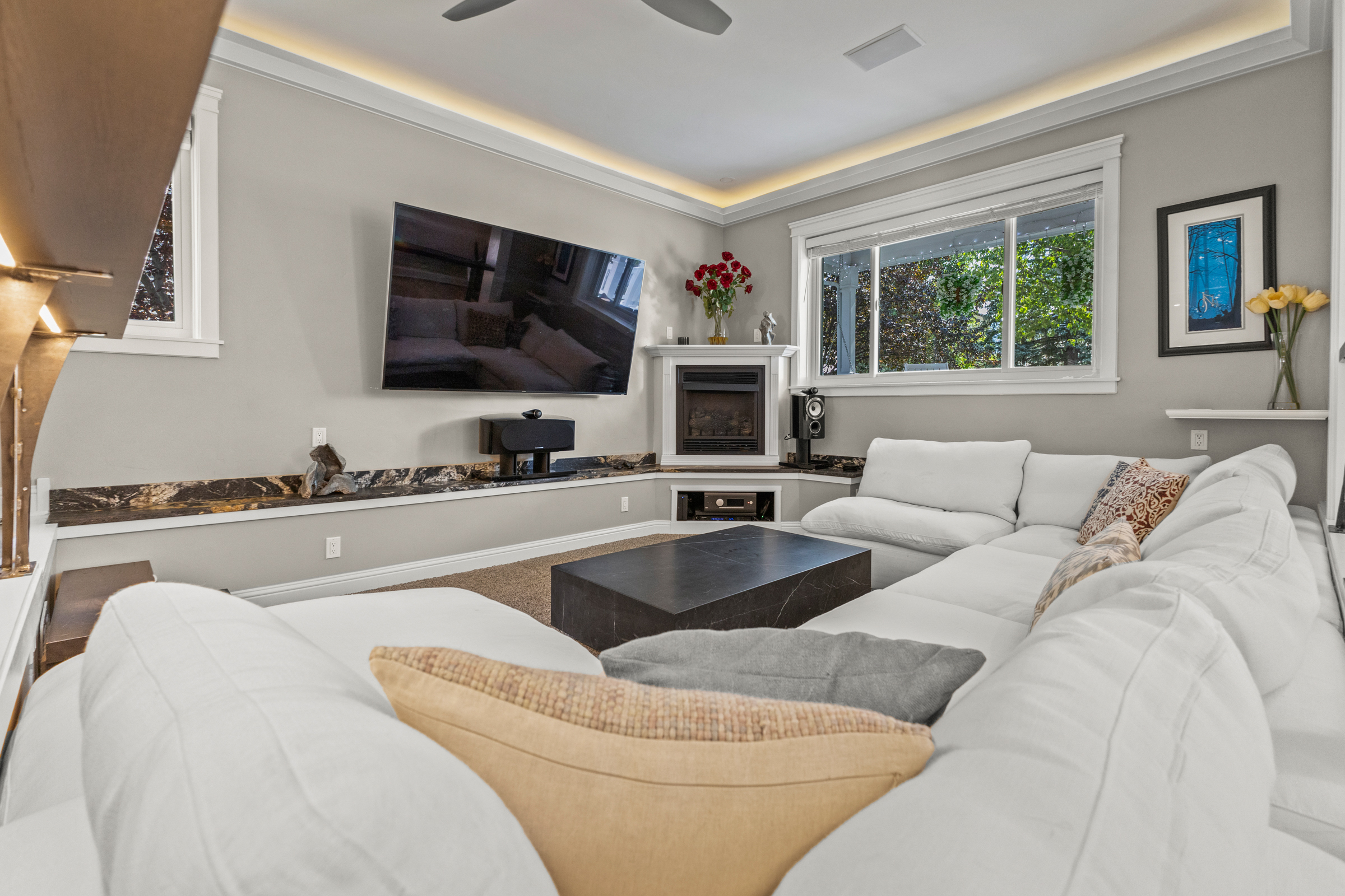 Living Room | Large Couch, Smart TV, and Fireplace