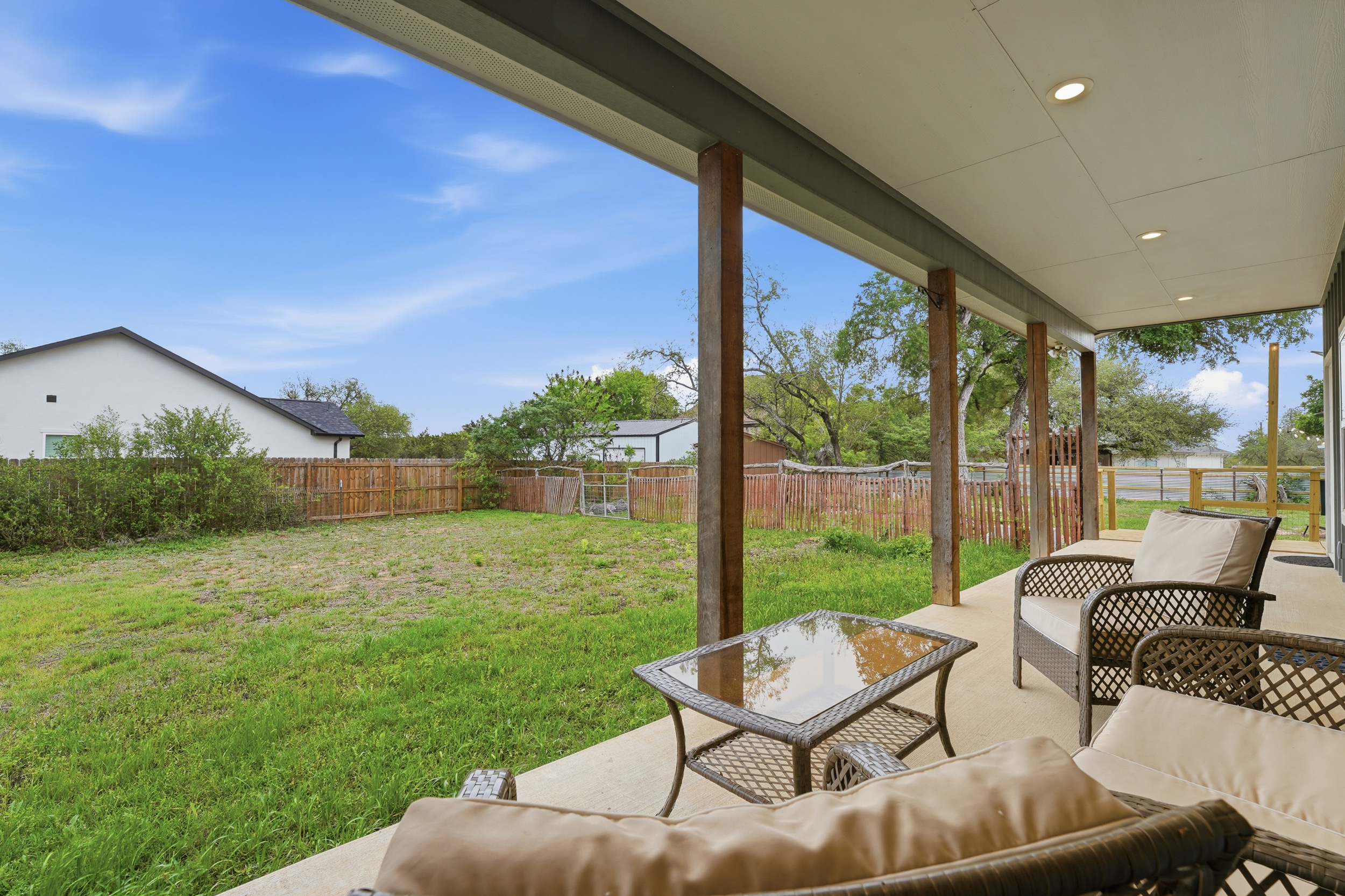 Covered porch — a quiet spot to sit, sip, and take in the Hill Country air