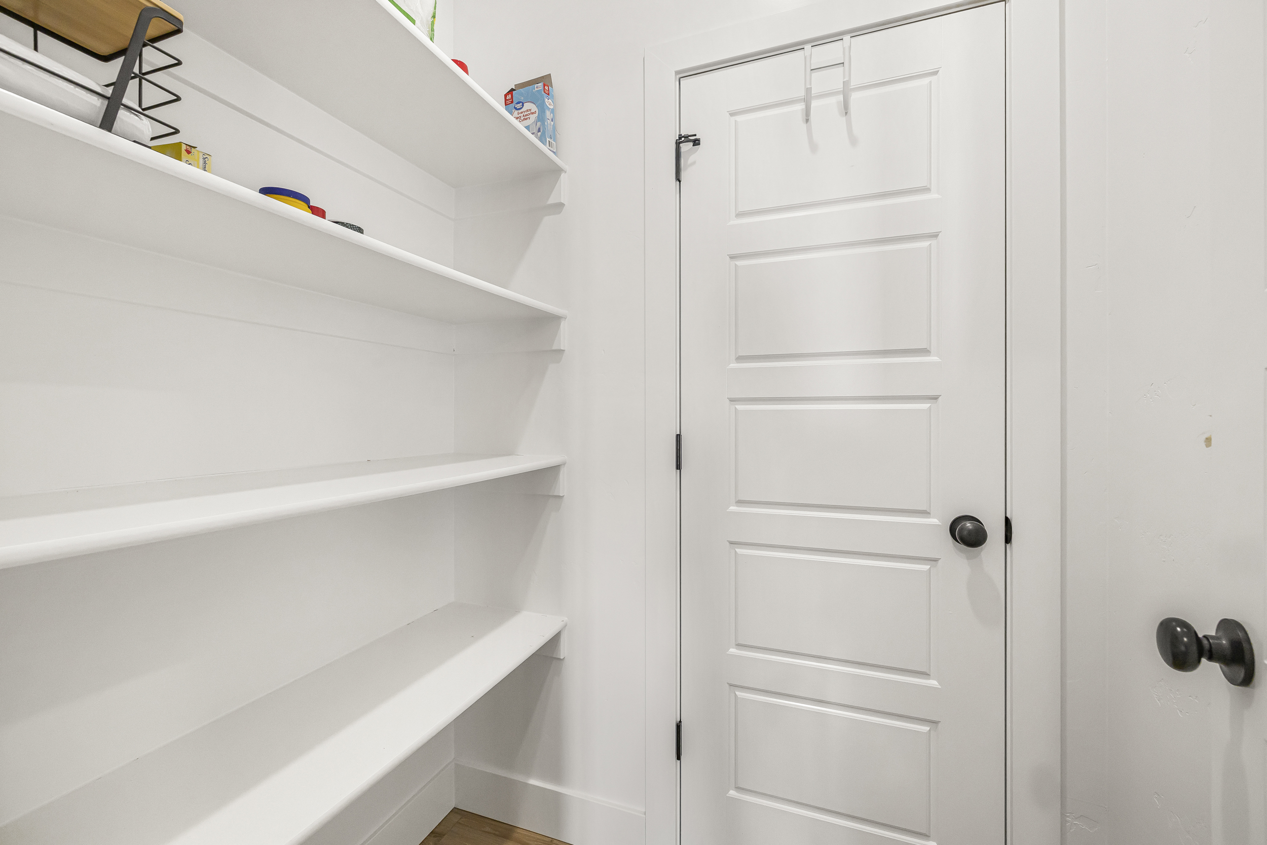 Walk-in kitchen pantry with lots of storage and easy access.