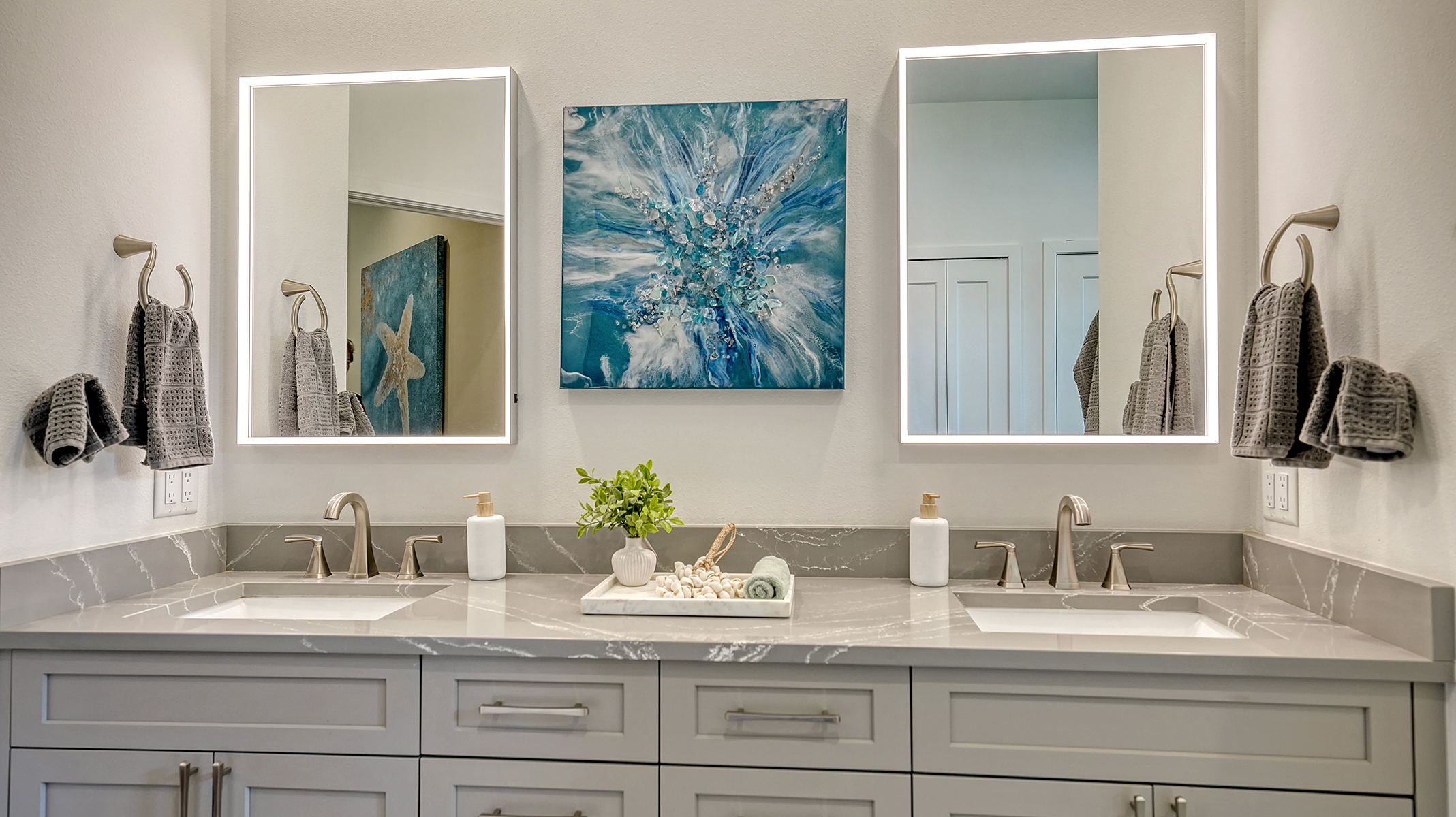 Dual backlit vanity mirrors in the master bath ensure a perfect shave and makeup application