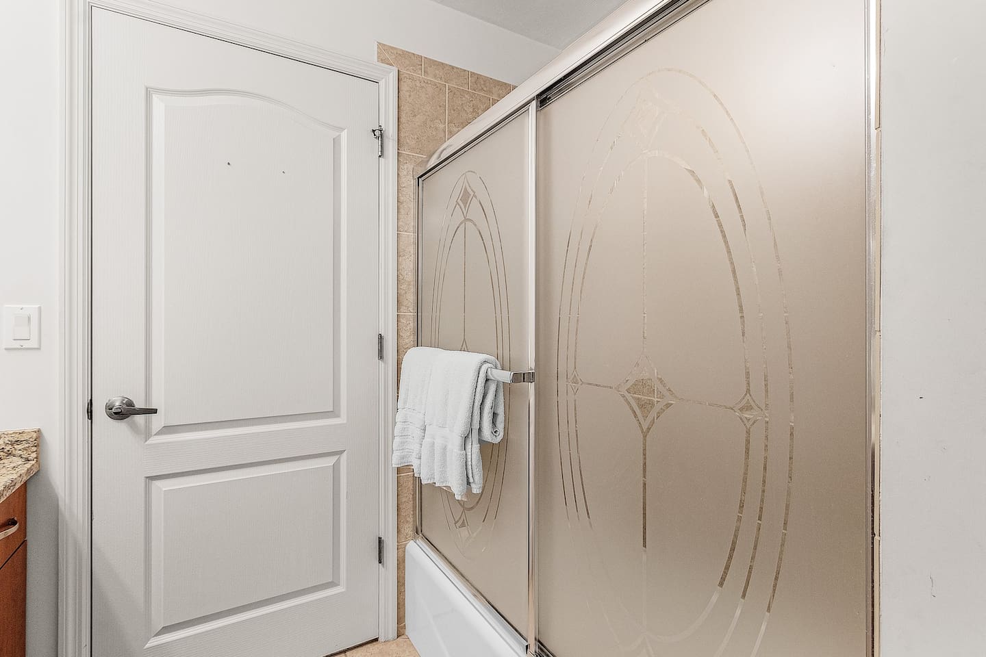 Inviting guest bathroom with a tub/shower combo perfect for any stay!