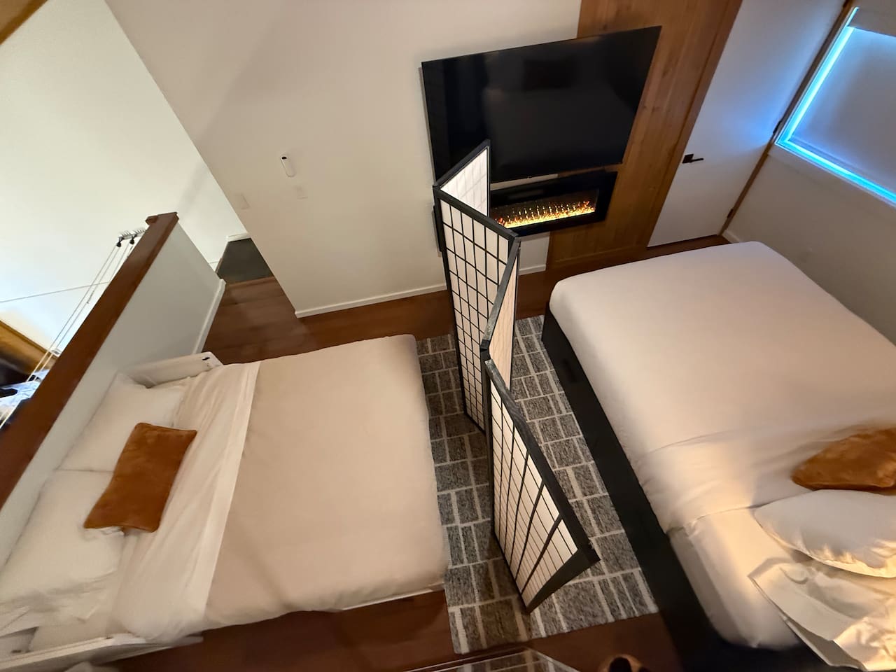 Flexible Sleeping Area: Two sleeping areas with privacy screen—both see the TV, mirrored closet & under-bed storage.