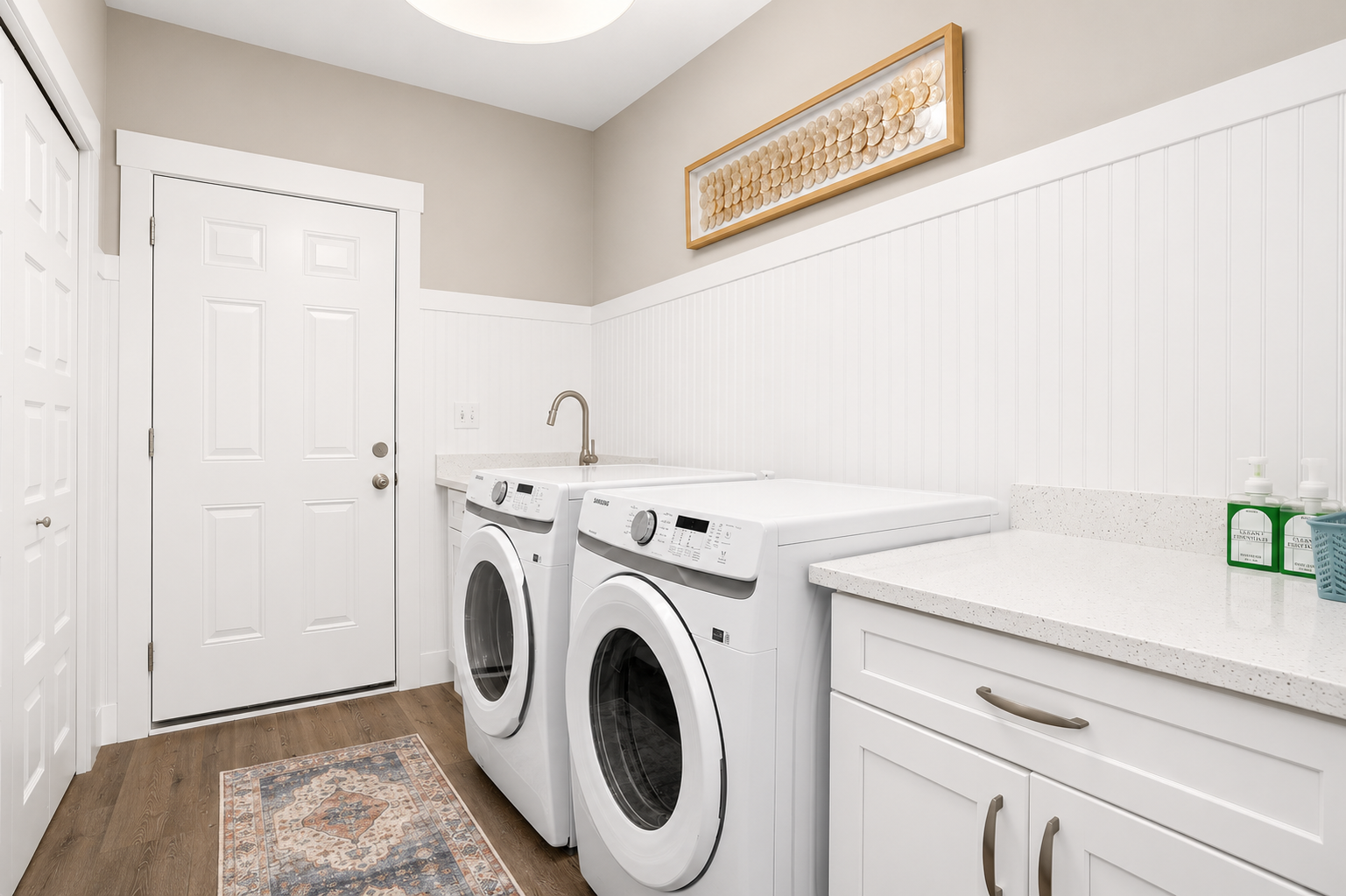 Enjoy the convenience of a dedicated laundry room with a full-size washer and dryer, making it easy to refresh clothes, towels, and beachwear during your stay.