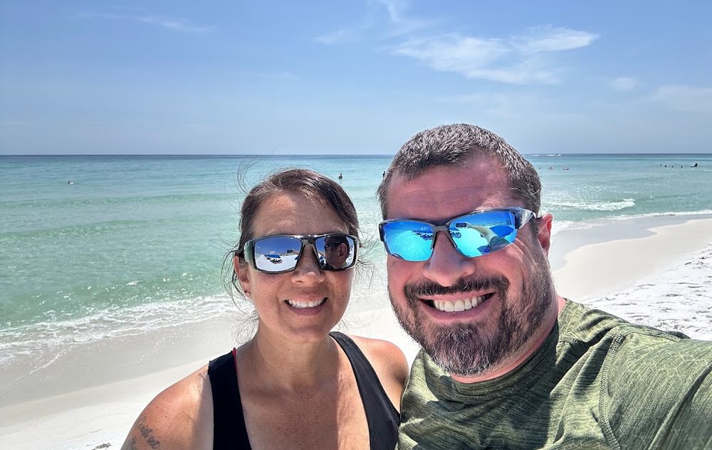 Paul and LeeAnna, owners of The Way Vacations, on the private beach at Southbay by the Gulf in Destin, Florida