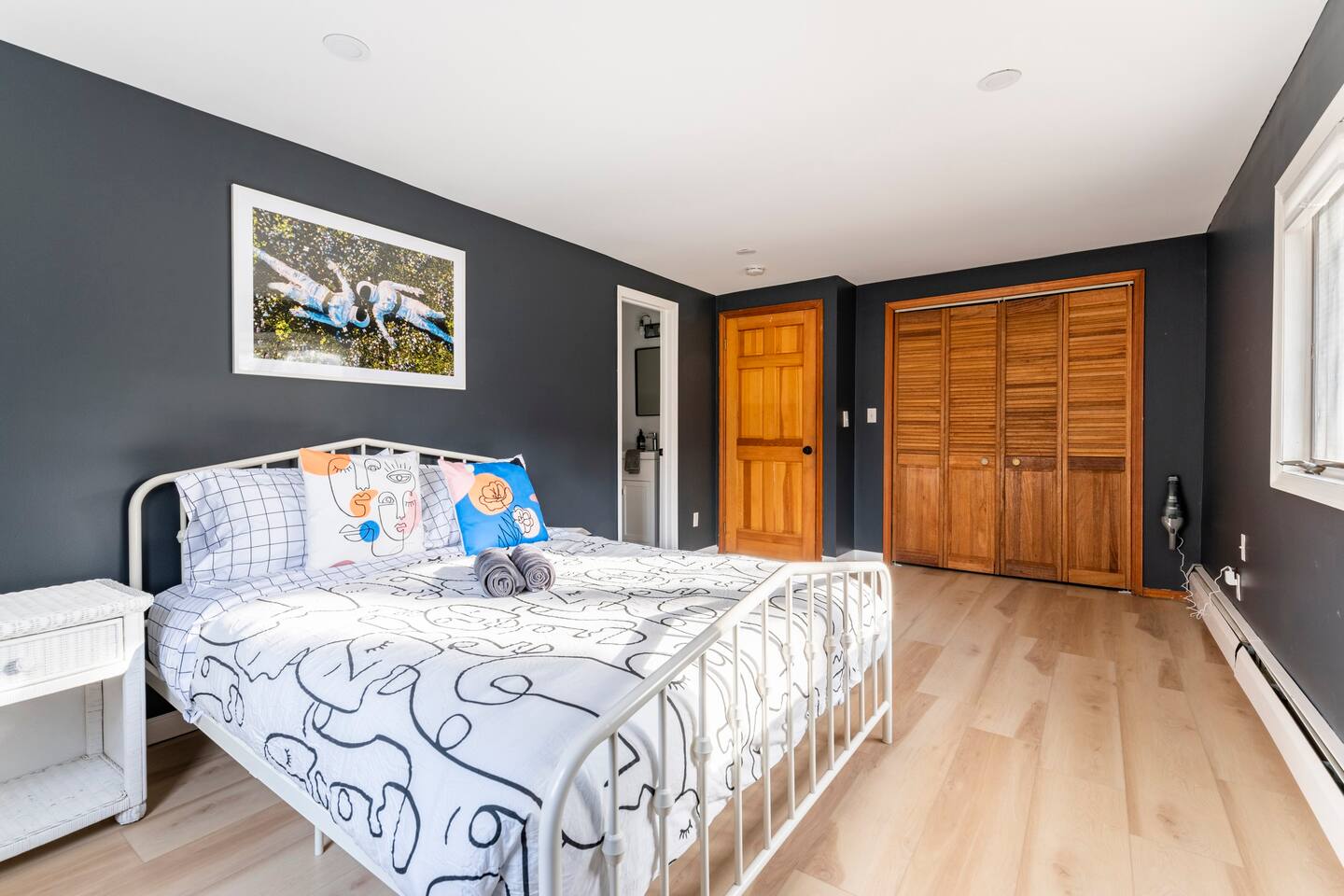 Master bedroom with closet and en suite bathroom.