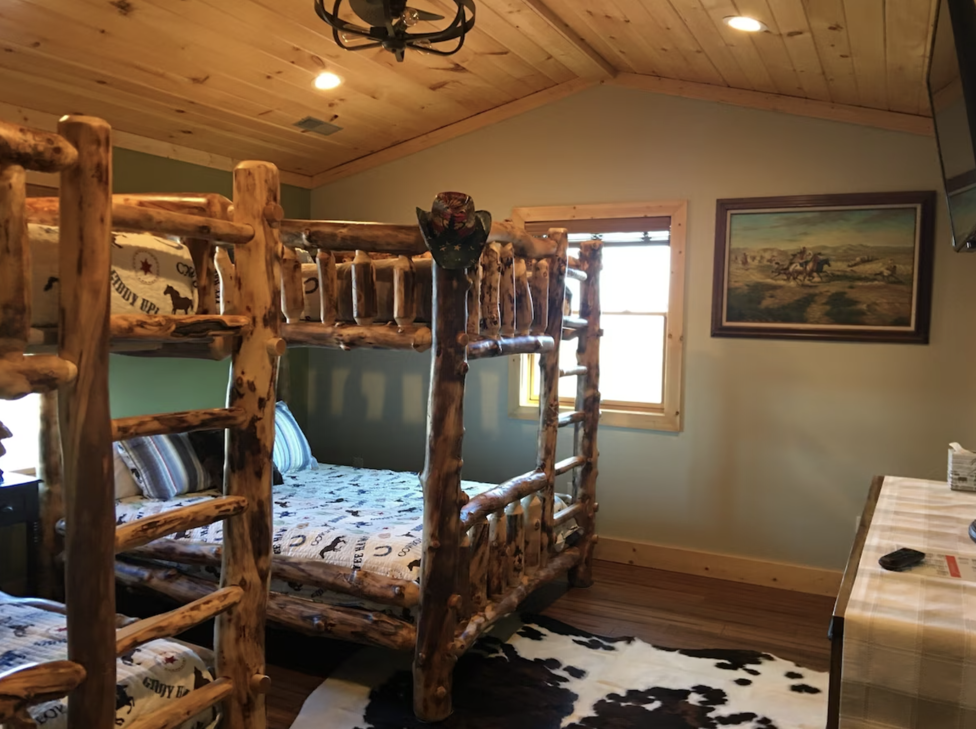 Let the little ones stay in the Cowboy Bunk Bed Room! Fun for everyone with 2 queen-sized bunk beds.