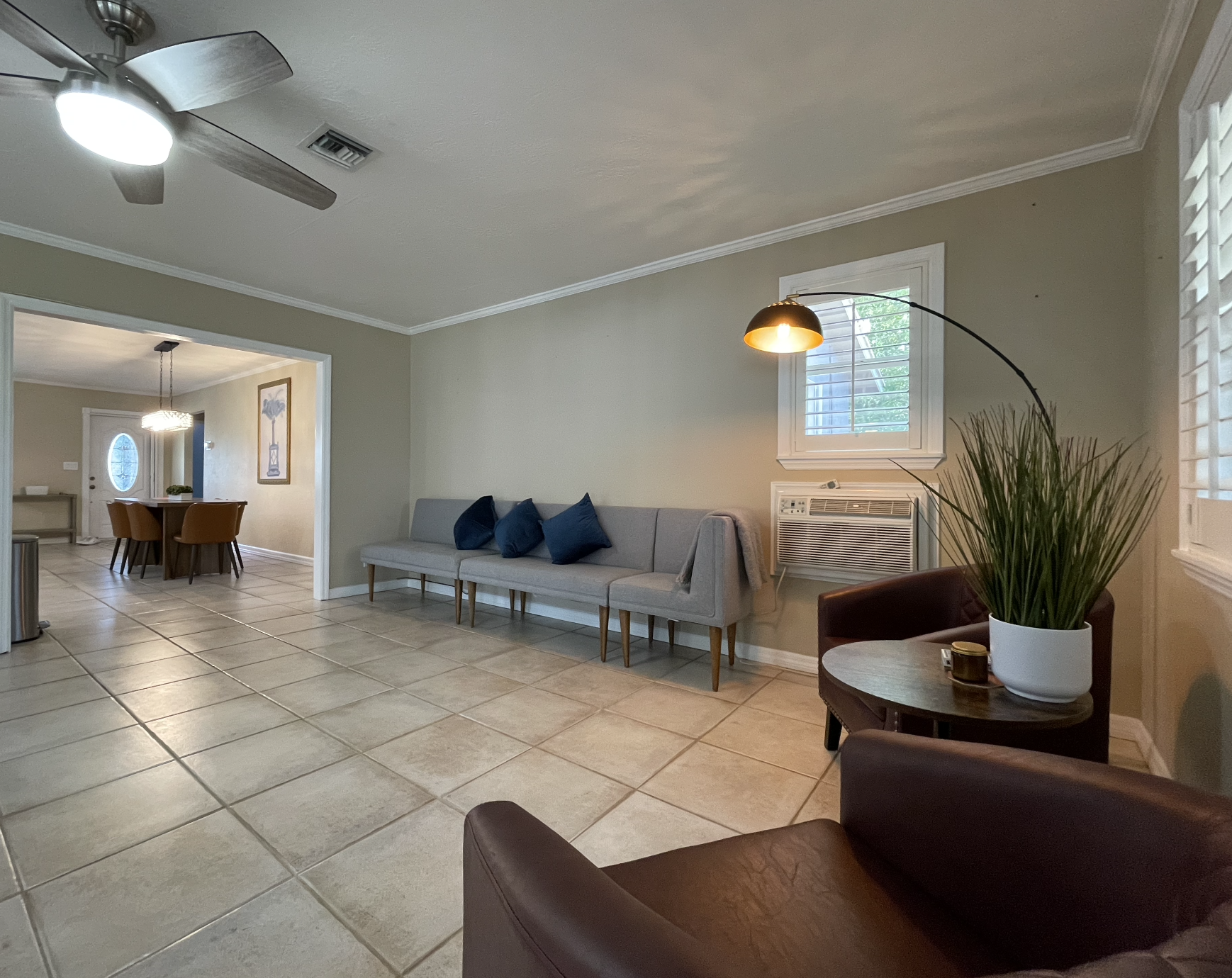 Our expansive rear living room has an abundance of seating and cozy nooks, as well as a comfortable couch with recliners.
