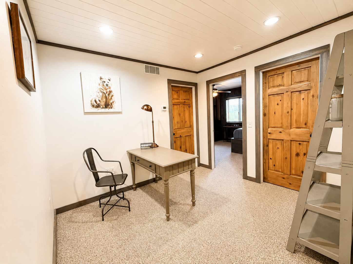 At the top of the stairs, this landing connects three private bedrooms and includes a handy desk/workspace—an easy, functional layout that gives your group convenient access to the upstairs sleeping areas.