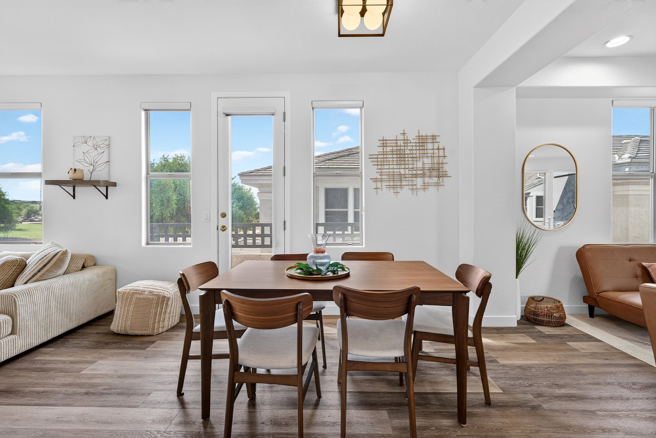 Dining area with table seating, natural light, and an open view toward for the lounge space and living area