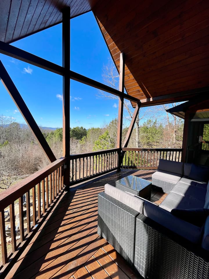 Mountain views from the wrap-around porch, large outdoor couch on the back deck a-frame overlooking the back yard! 
