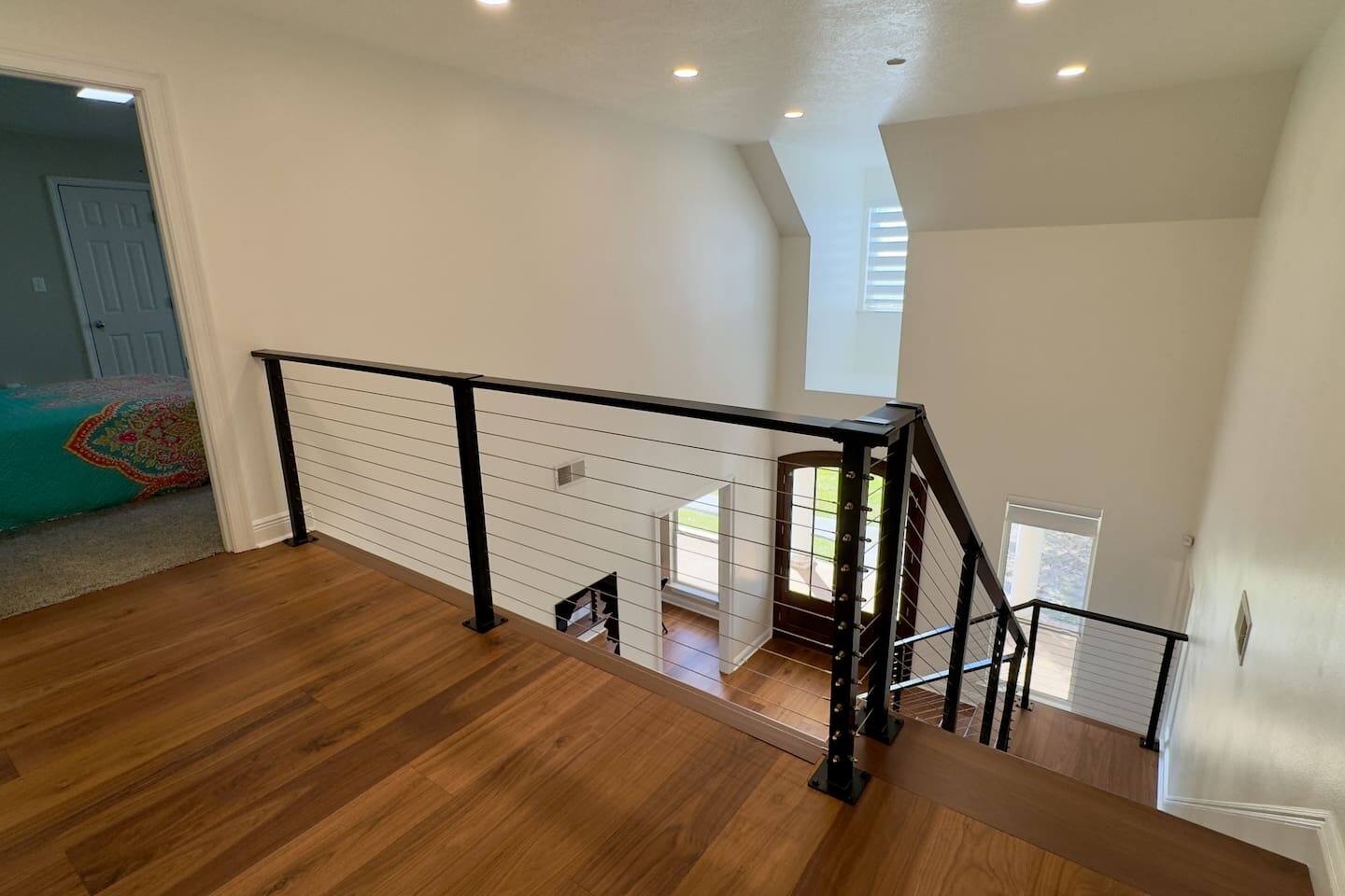 A small landing at the top of the stairs connects seamlessly to the upper floor