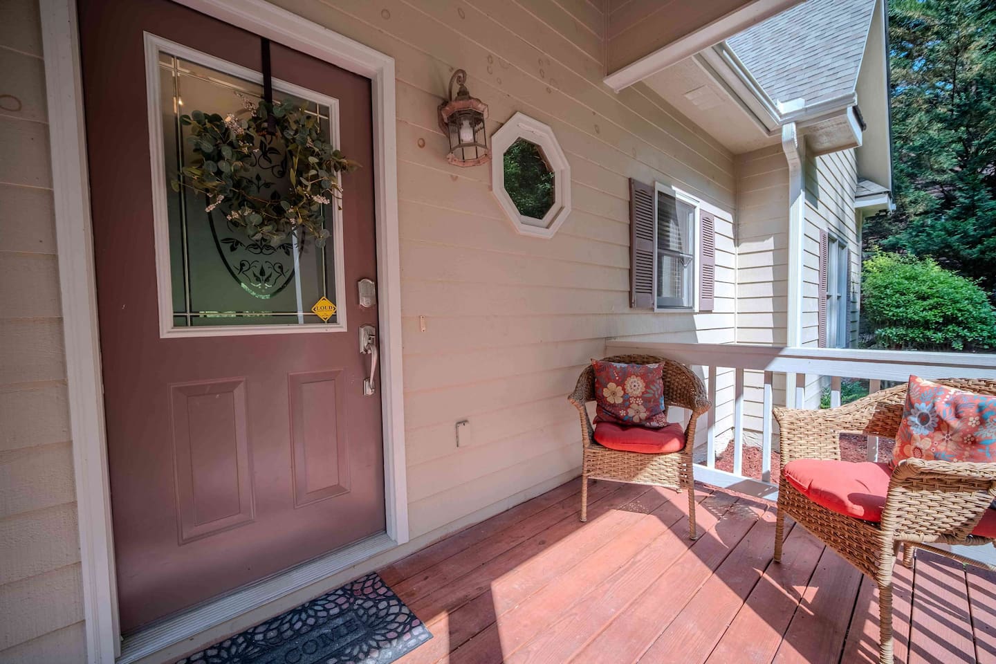 Step onto the inviting front porch, where cozy wicker seating and cheerful cushions create the perfect spot to sip sweet tea or greet the morning sun. It’s just a taste of the comfort waiting inside.