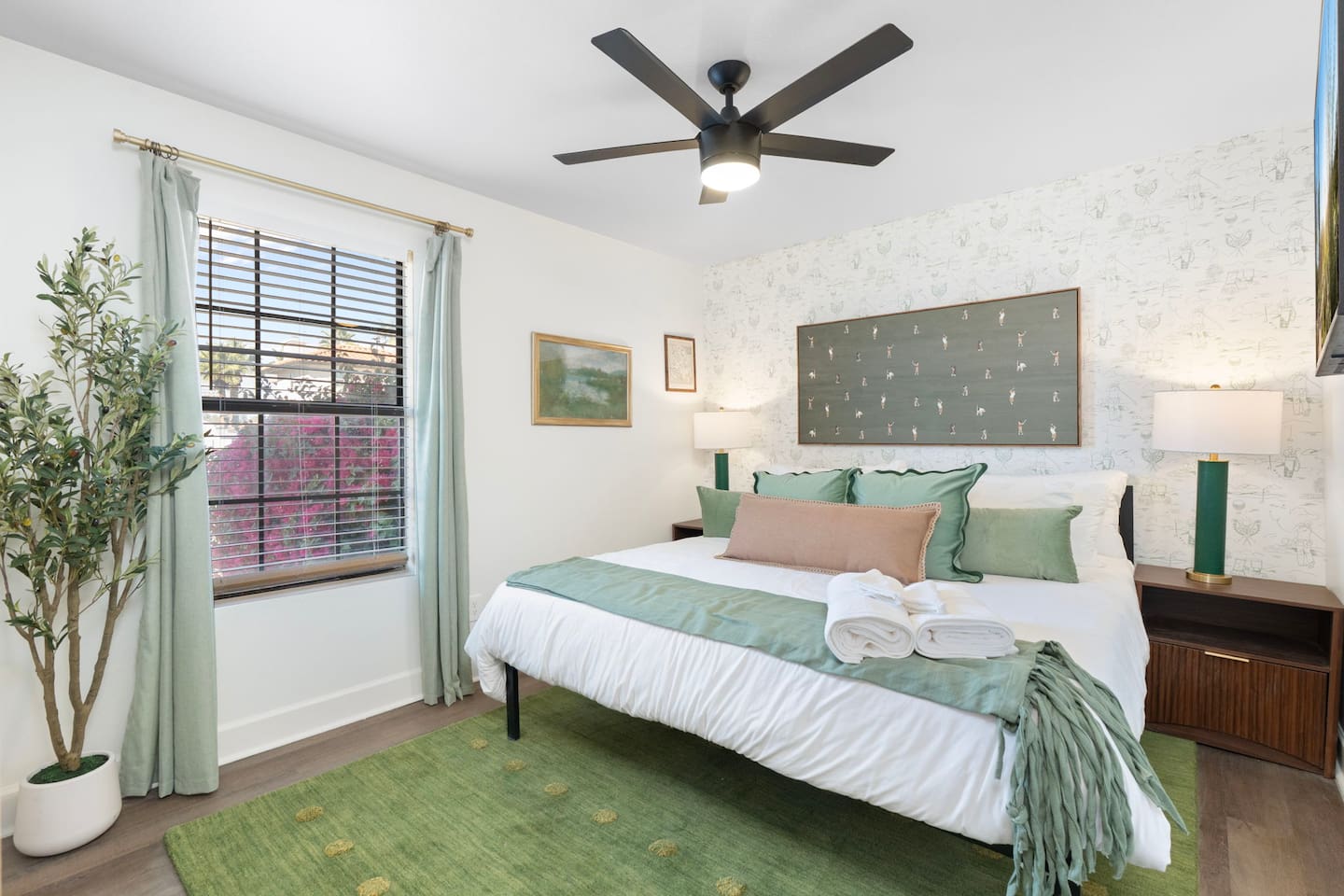 Serene guest bedroom with soft green palette, natural light, and layered textures—a peaceful retreat for rest and relaxation.