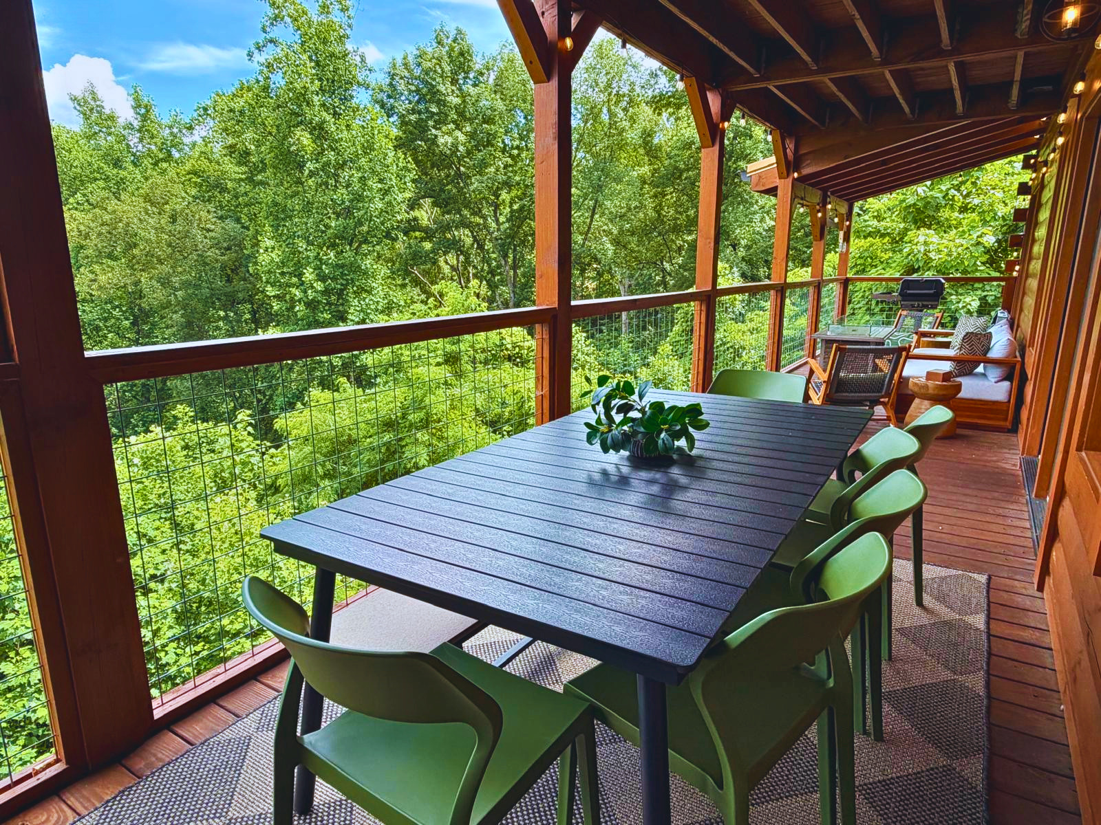 Dine among the treetops on the covered deck, surrounded by the peaceful beauty of the Smoky Mountains.