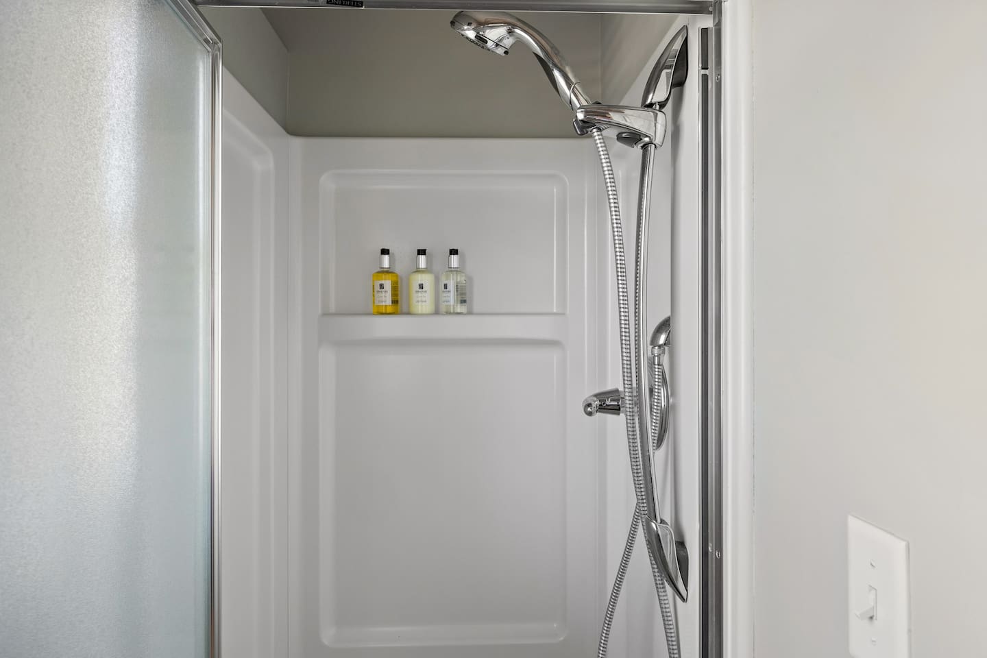 Main floor shower is located in laundry room and is perfect for cleaning off after a day at the beach.