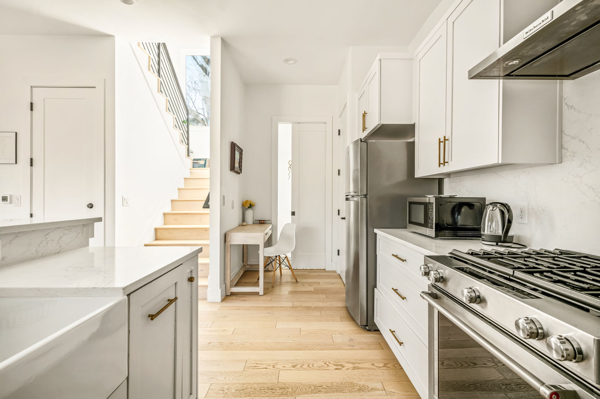 Fully equipped kitchen with stainless steel appliances and ample prep space