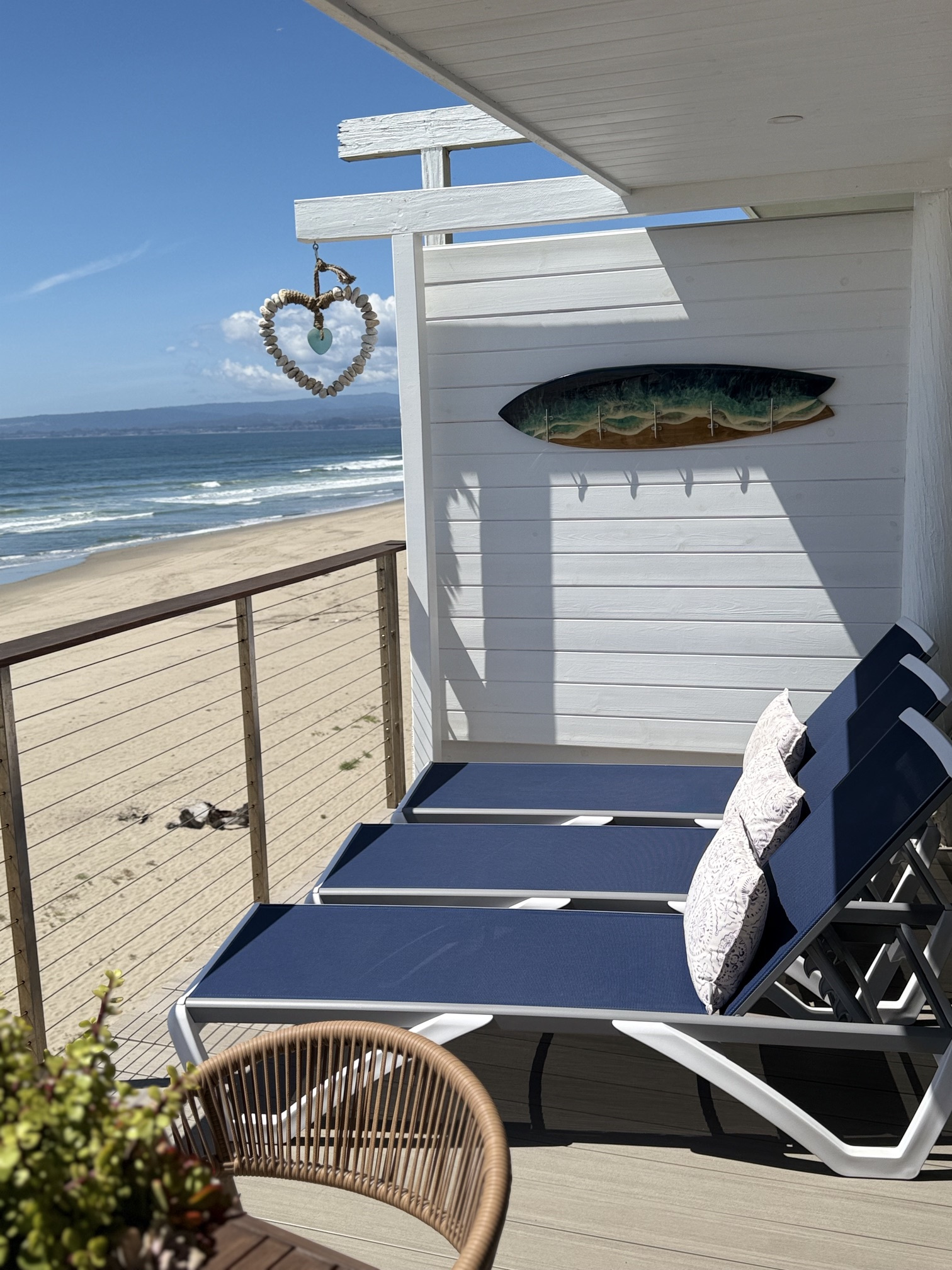 Beachfront living at it's finest! Enjoy our newly remodeled sun-drenched deck with panoramic ocean views!