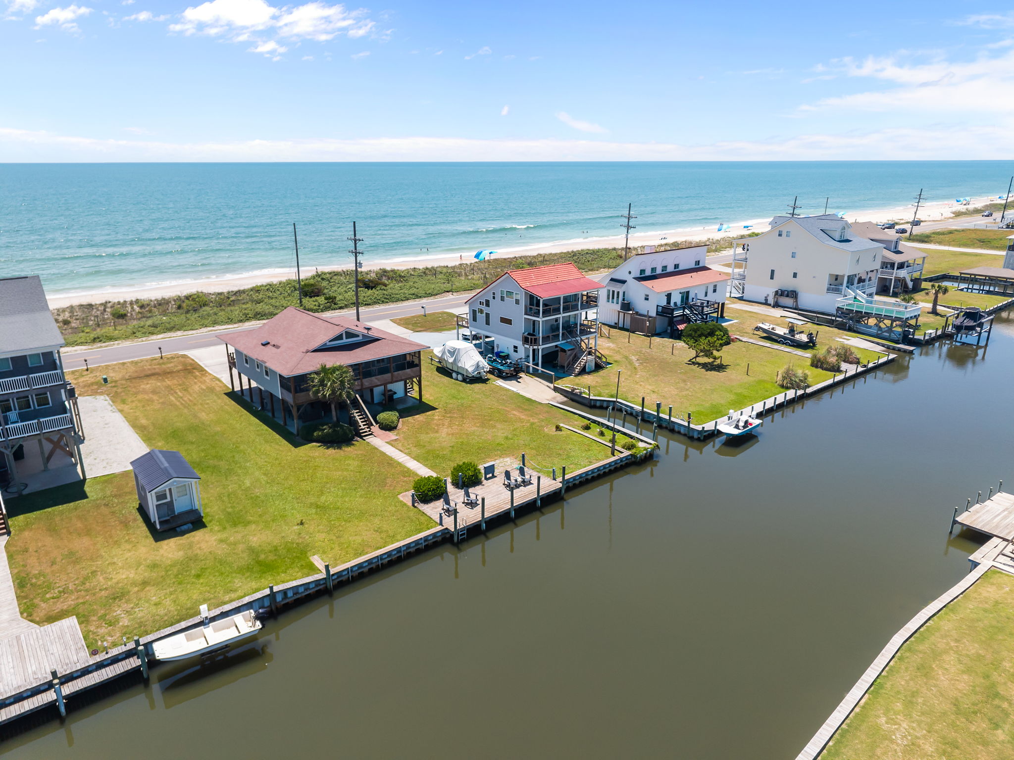 Experience dual waterfront living with canal serenity on one side and ocean breeze on the other