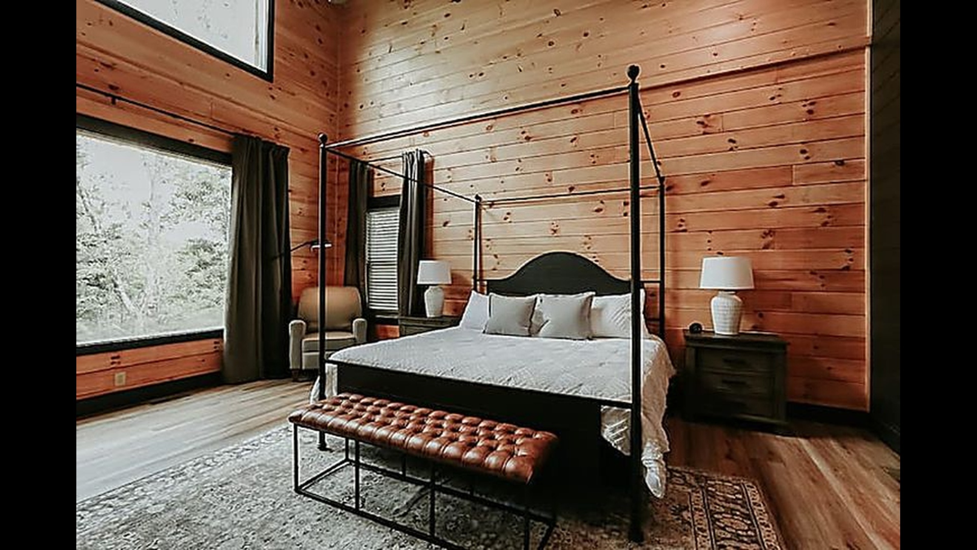 A peaceful bedroom retreat with natural light and calming forest views to start and end your day