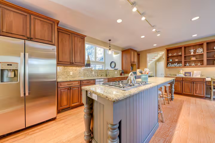 Well appointed kitchen features stainless steel appliance