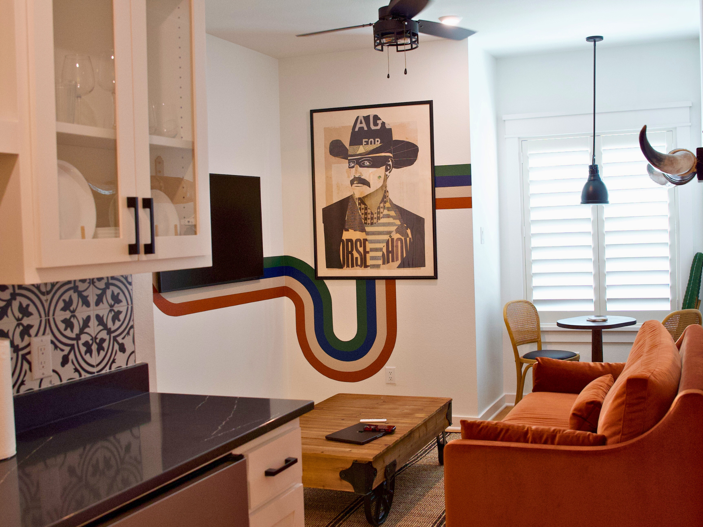 Living area with comfortable seating and natural light, perfect for relaxing after exploring Frisco’s Rail District.