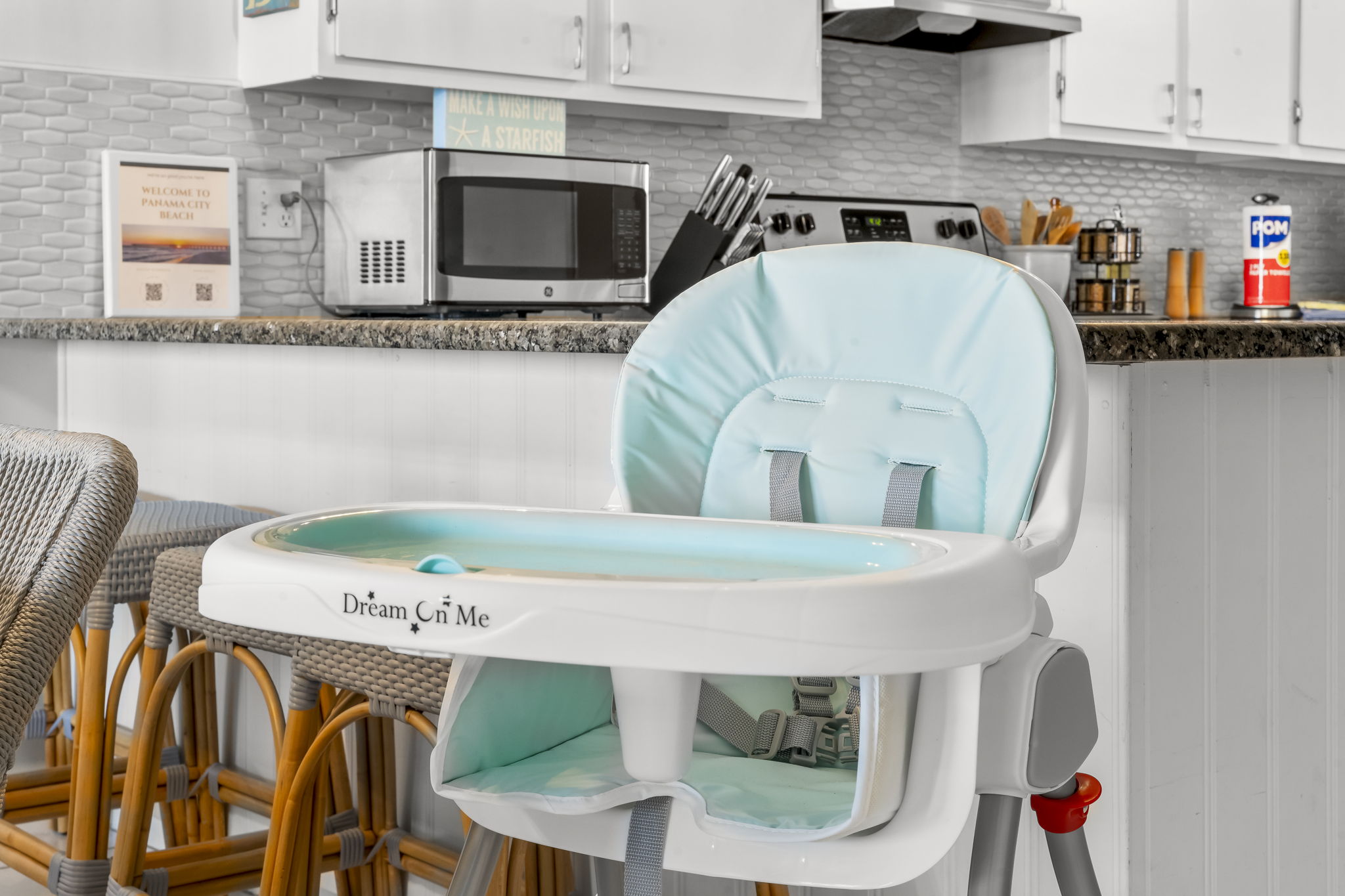 High chair is stowed away in the master bedroom closet.