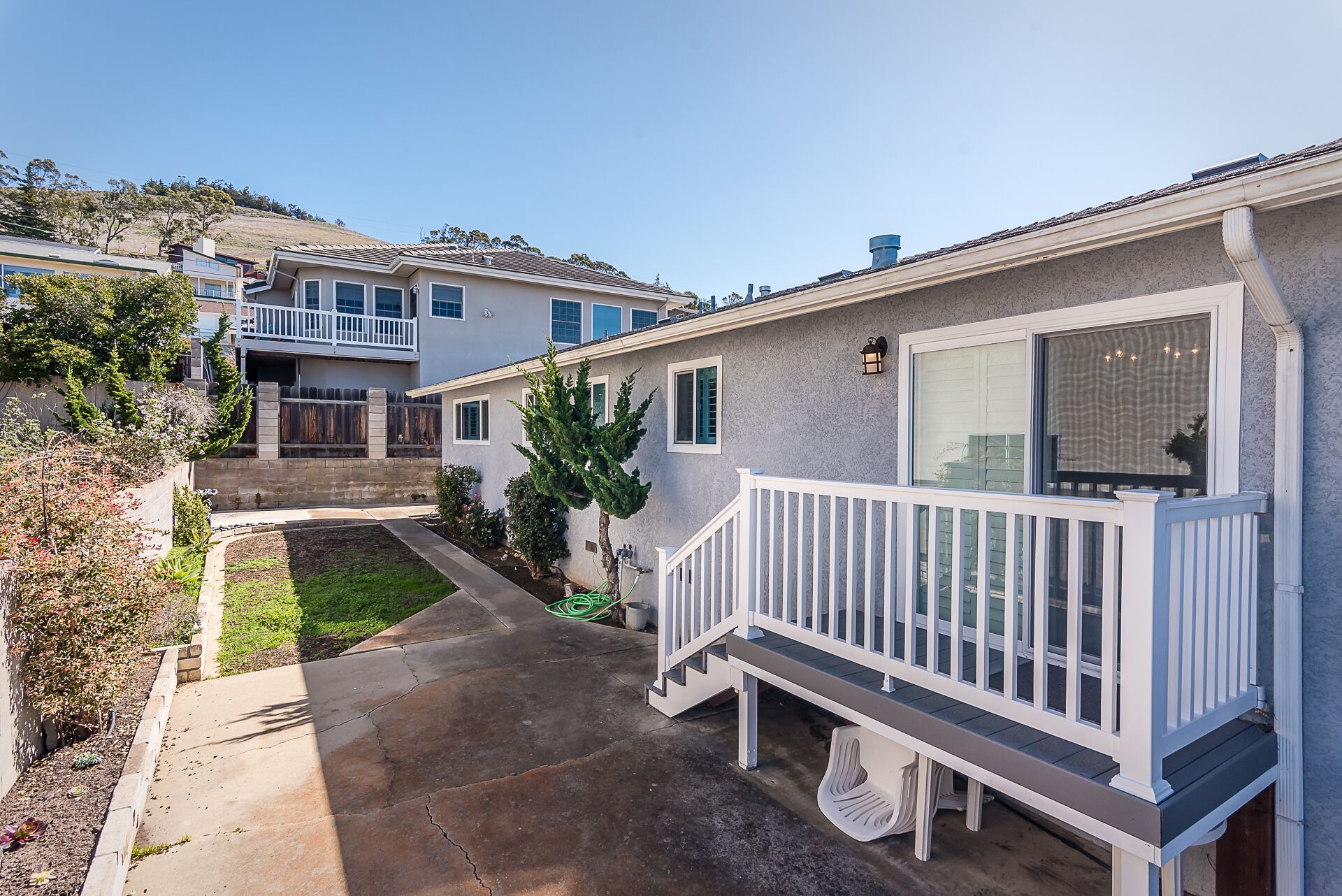 Backyard & deck with charcoal BBQ