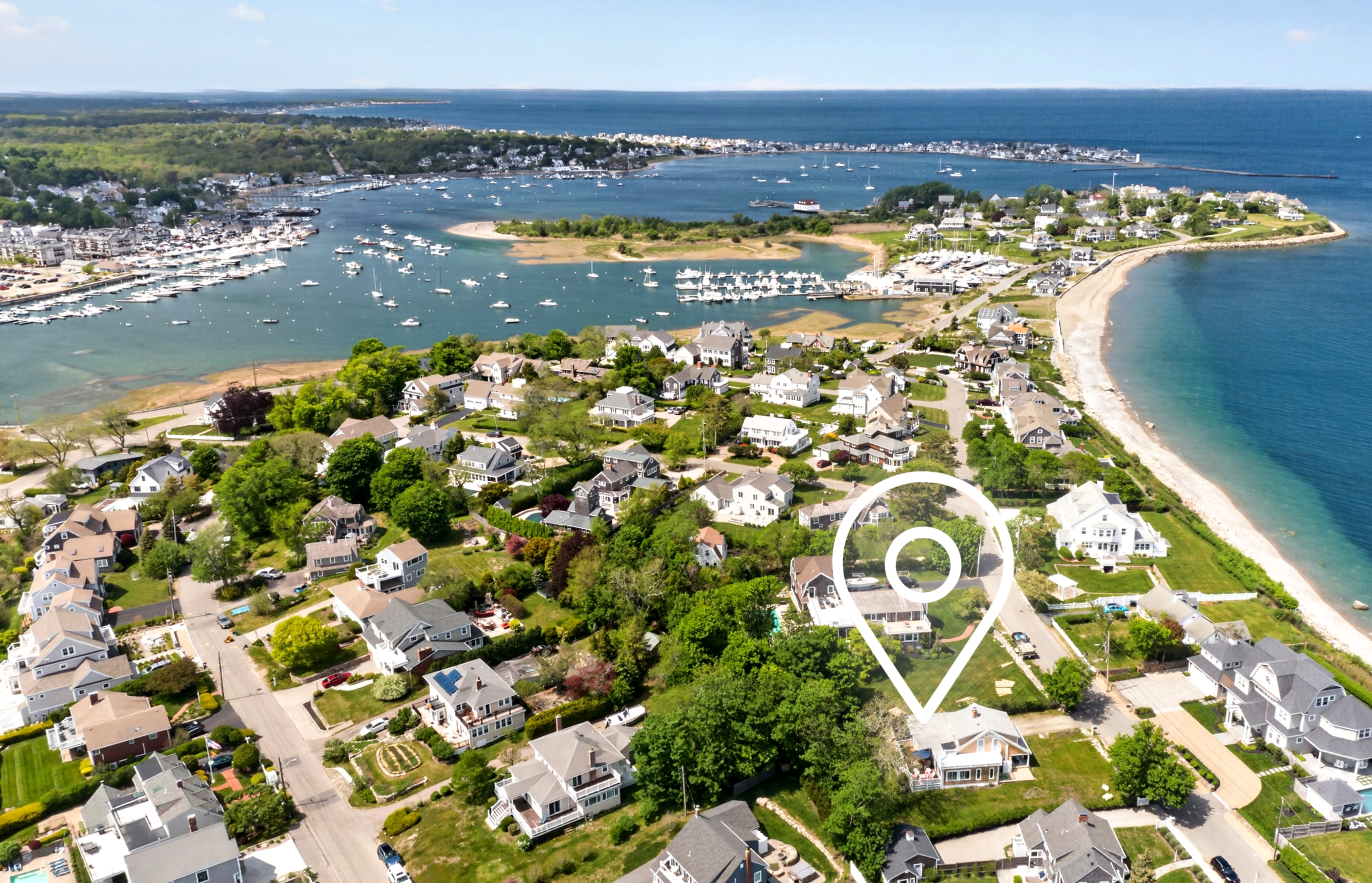 An aerial view of the house and its surrounding coastal landscape.