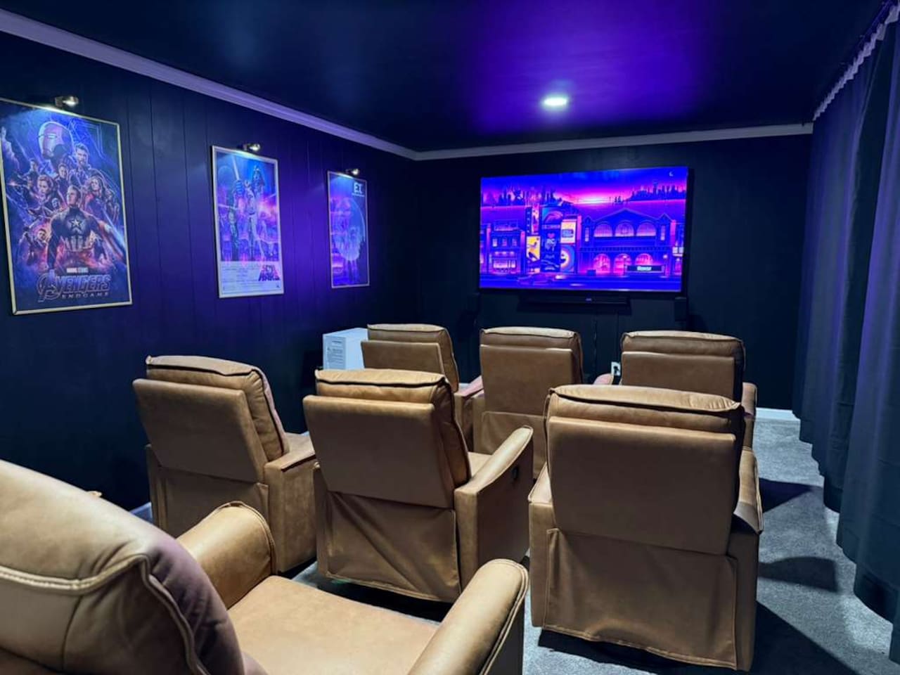 Private home theater with plush recliners, surround sound, and a 4K screen while you enjoy microwave pop corn and access to minifridge and bar table — the ultimate movie-night experience