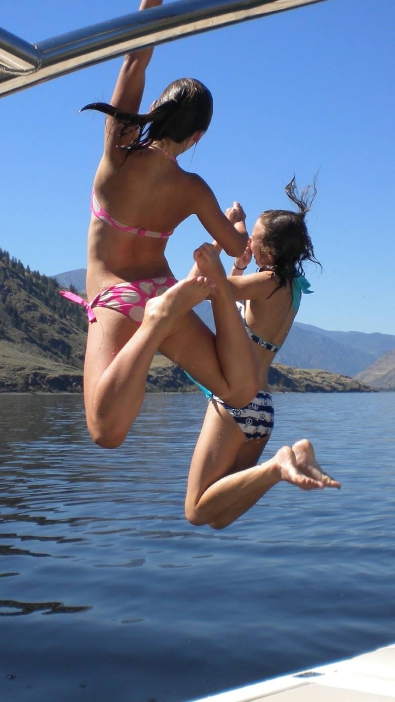 Kids jumping into Palmer Lake on a sunny day