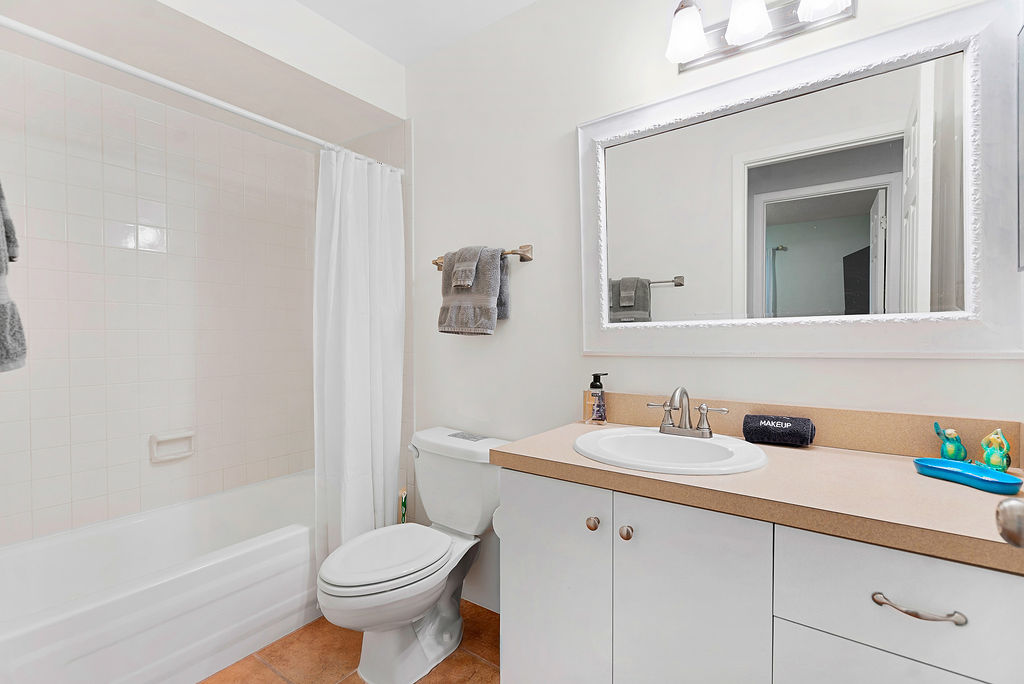 The second full bath is between bedrooms 2 and 3.