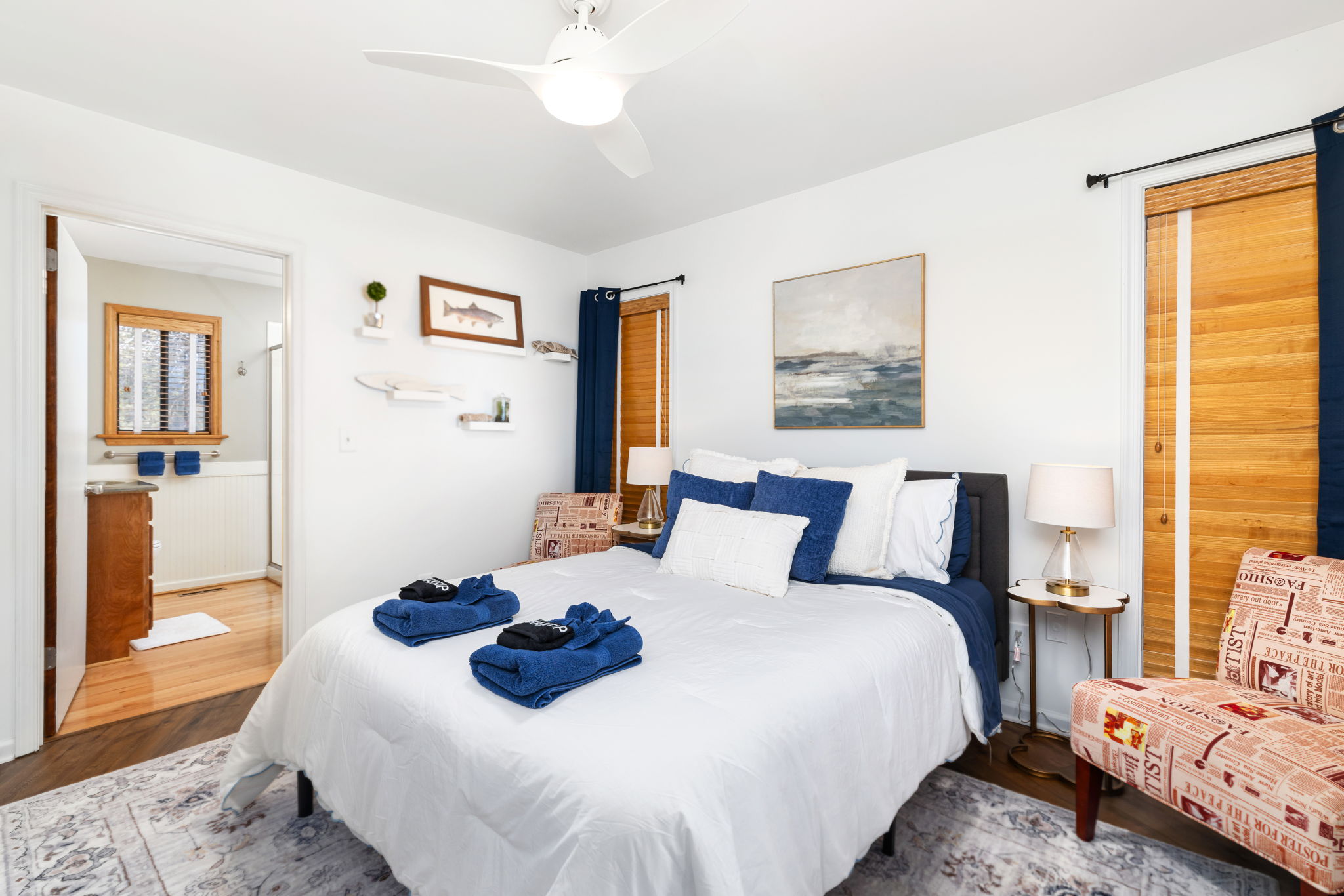 Charming Queen Bedroom 1: Bright, breezy space with artistic accents and plush bedding awaits!