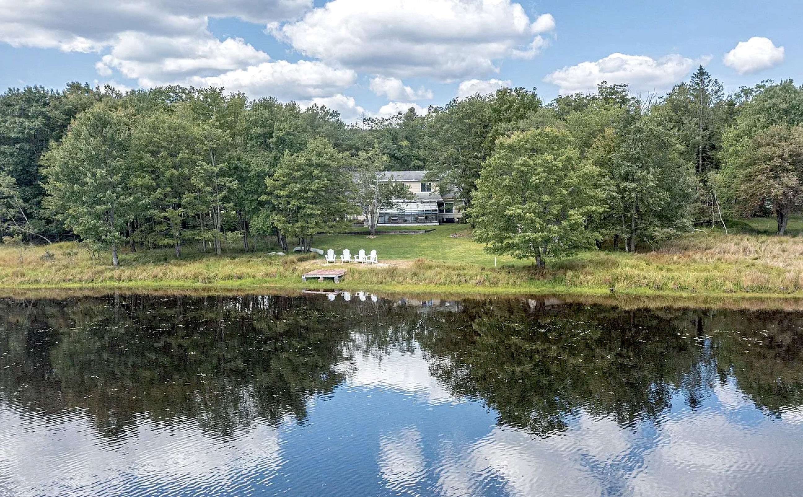 The house that mirrors the lake — architectural poetry.