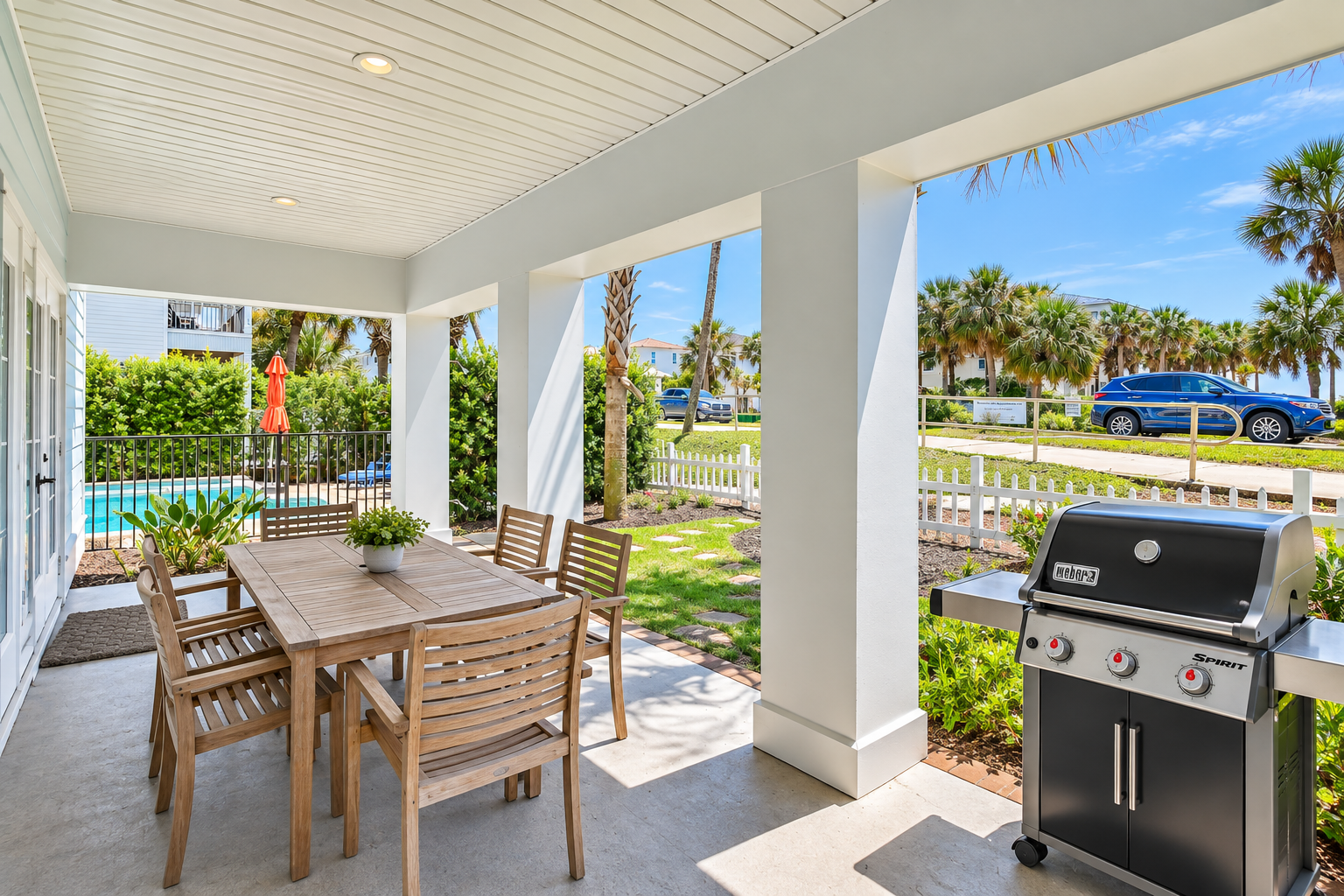 Relax and dine in your private outdoor space, surrounded by lush palms and beautiful 30A scenery. Enjoy easy outdoor entertaining with a spacious dining area and grill.