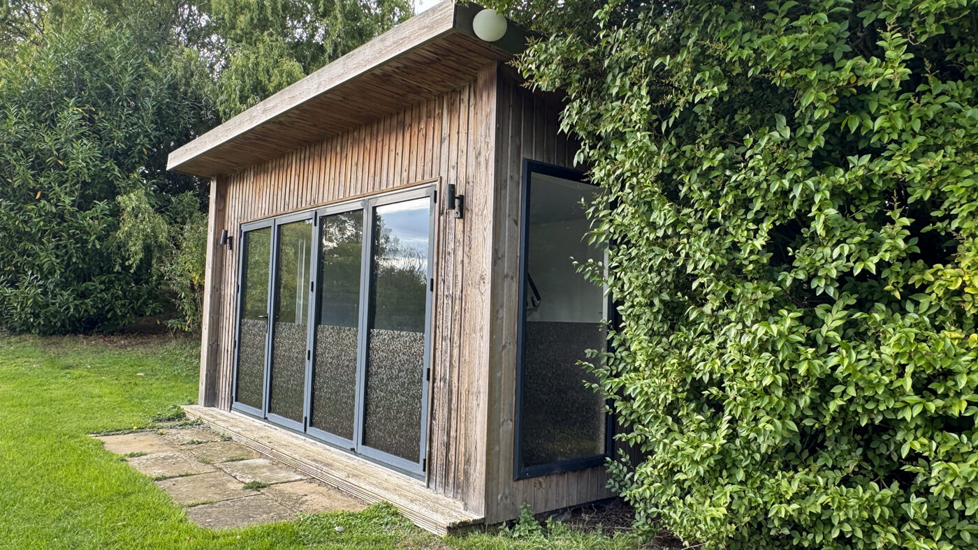Gym building is opposite the house over the lake