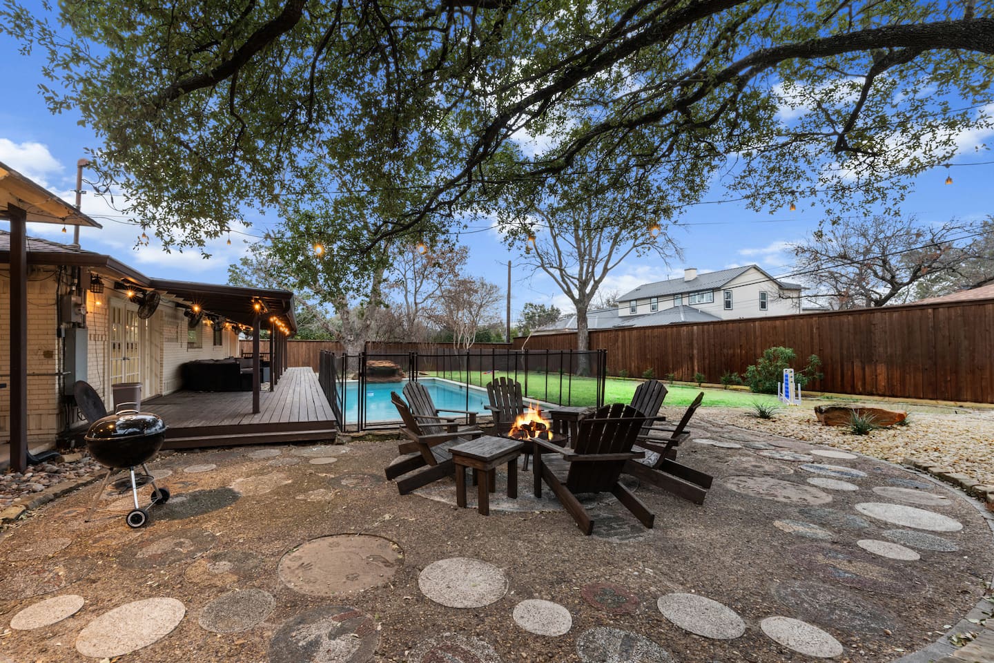 Enjoy a night under the stars with good conversation around the wood-burning fire pit with seating for 6! There is a grill, twinkle lights, and plenty of life-sized games for your enjoyment.
