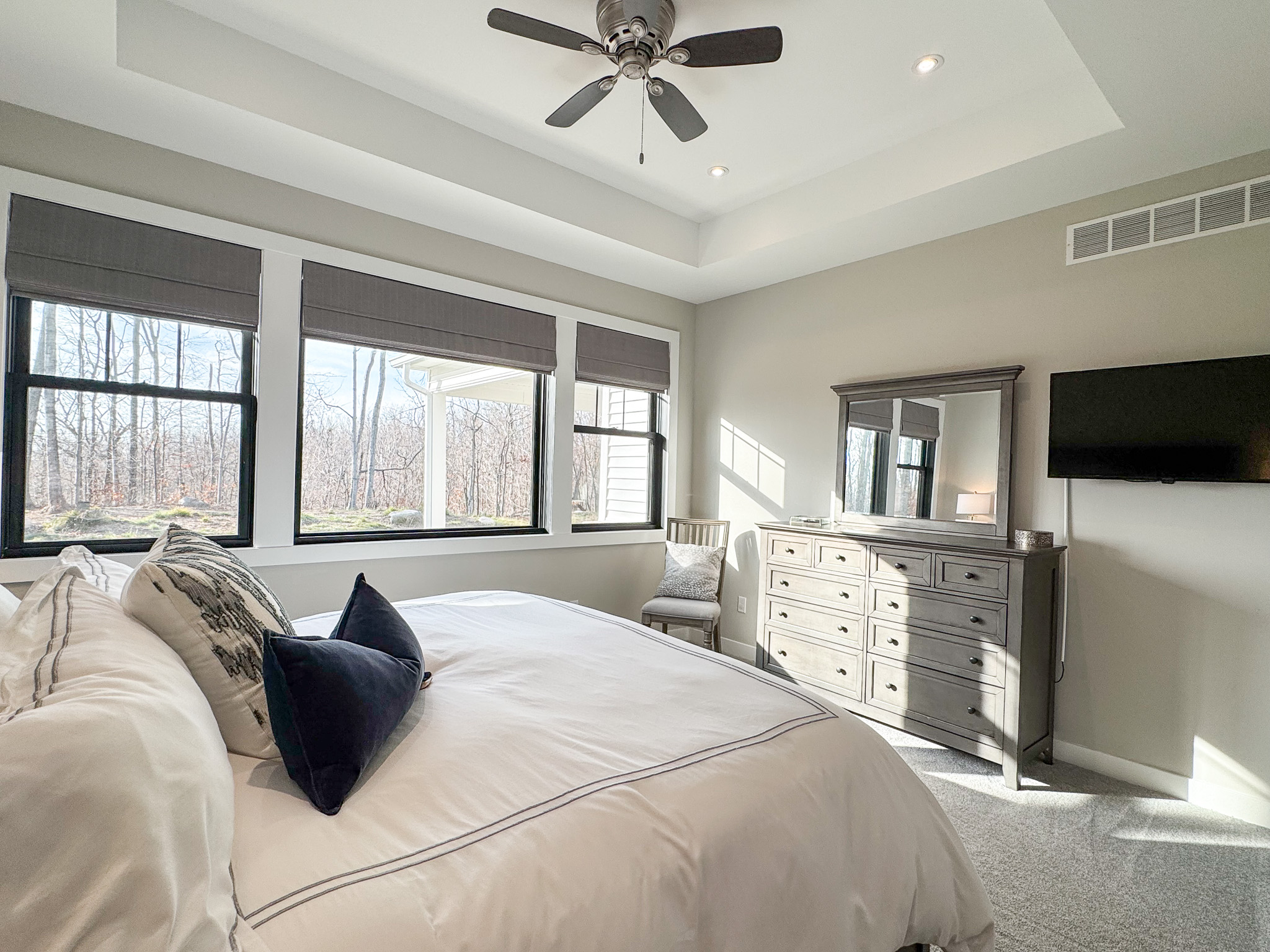 Primary bedroom with tv and streaming services.
