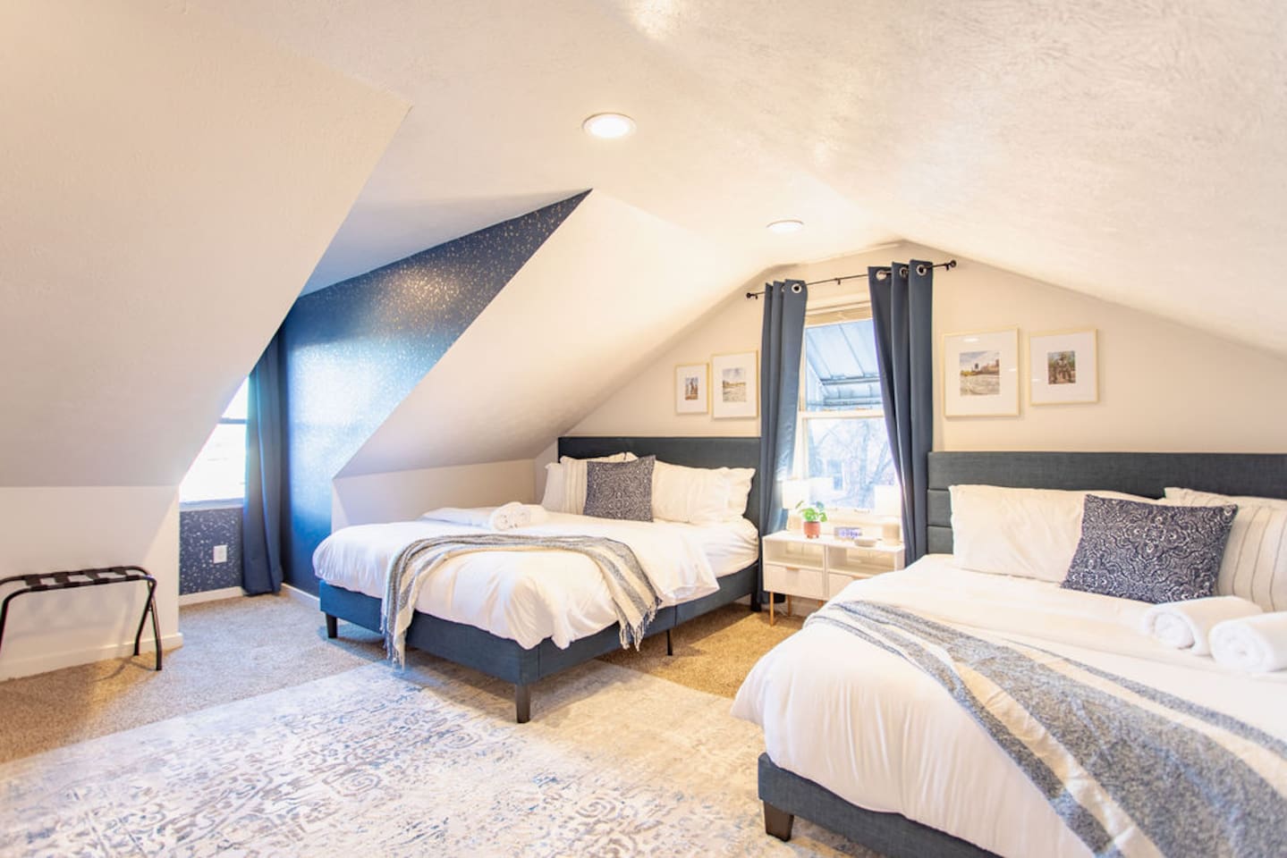 Spacious bedroom featuring two king beds, offering ample comfort and plenty of space for families or groups looking to relax together.