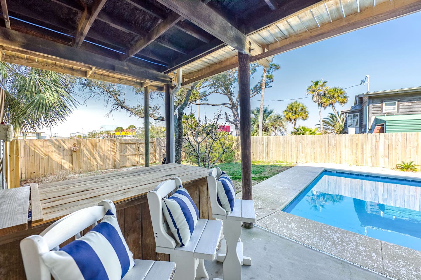 Outdoor Lounge: Sip cocktails on the shaded deck while soaking in sunny poolside vibes!
