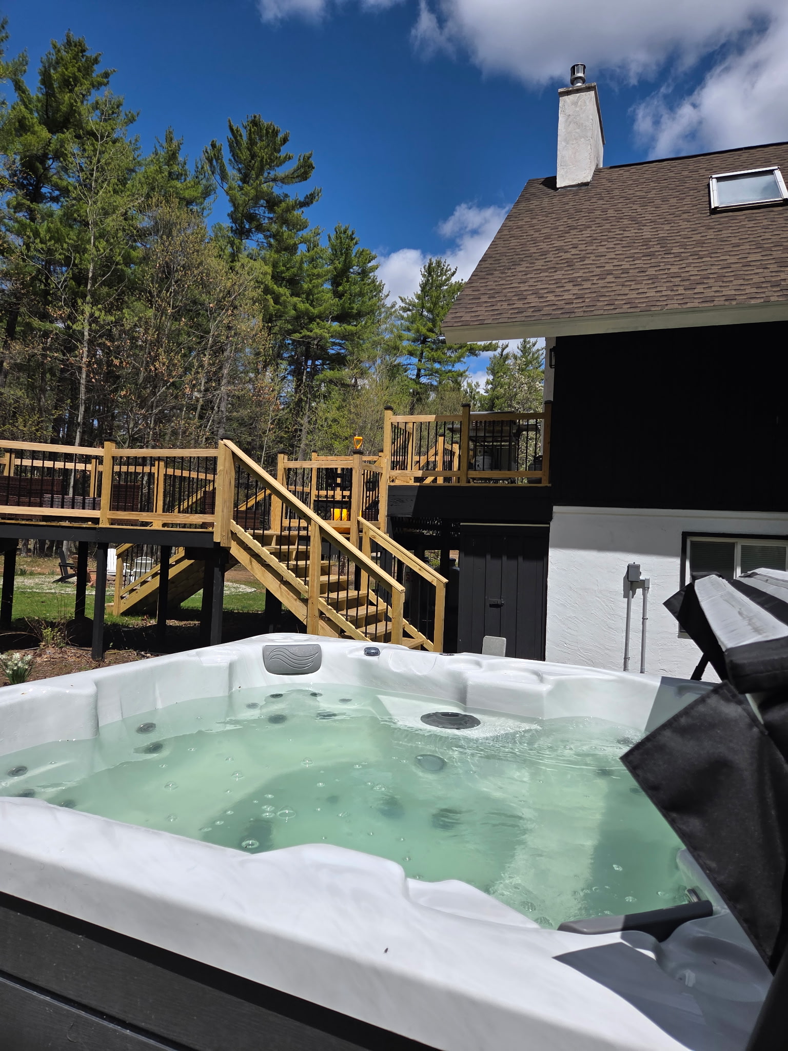 Enjoy a private hot tub surrounded by the Adirondack trees, perfect for unwinding after a day of hiking, skiing, or exploring the mountains.