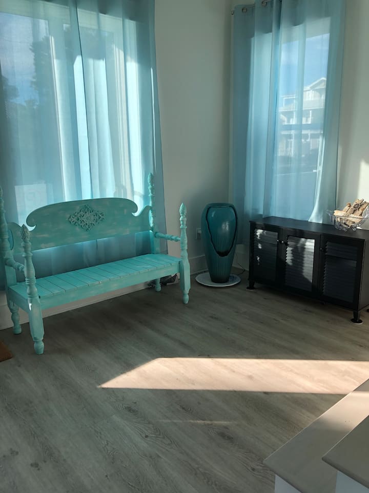 Experience instant Zen! ✨ Our first-floor entry features a calming Feng Shui water fountain and a unique turquoise bench. A serene sitting area designed for peace and style—the perfect welcoming touch to your Blue Mountain Beach retreat. 