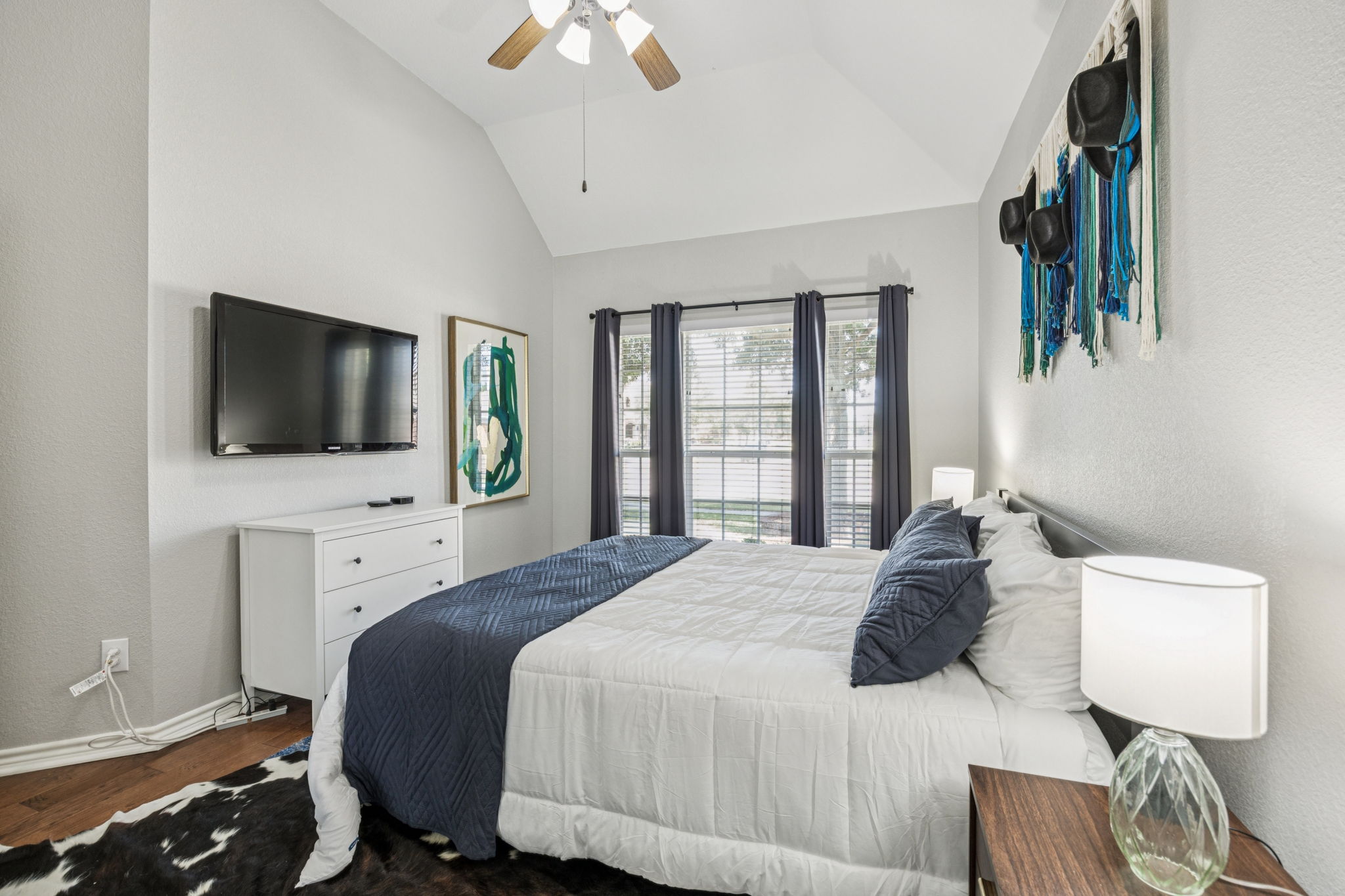 Cozy room with ample light and a 40” Apple TV for easy streaming.